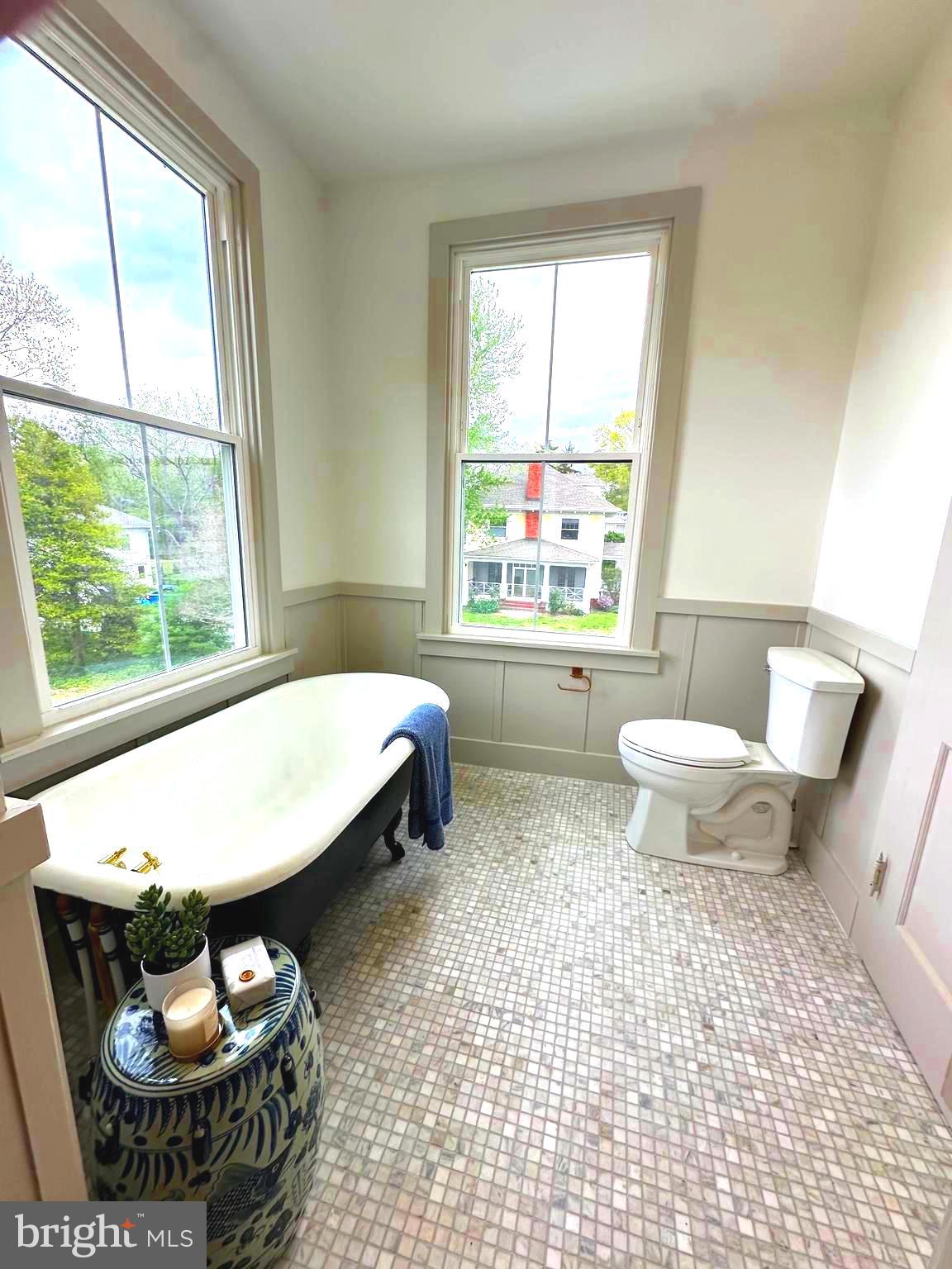 3860 Main Street Trappe, MD 21673 - Photo 39 of 58 a bathroom with a toilet a sink and a window