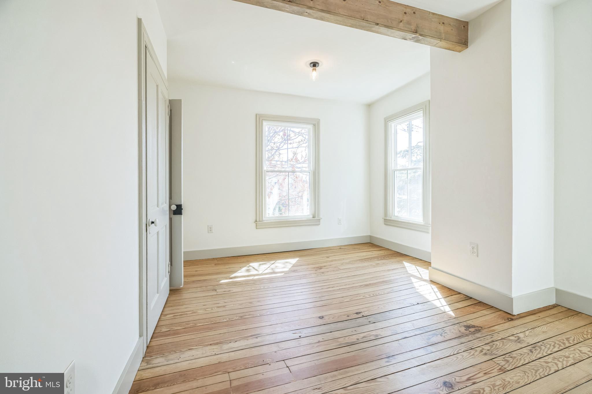 3860 Main Street Trappe, MD 21673 - Photo 41 of 58 a view of an empty room with wooden floor and a window