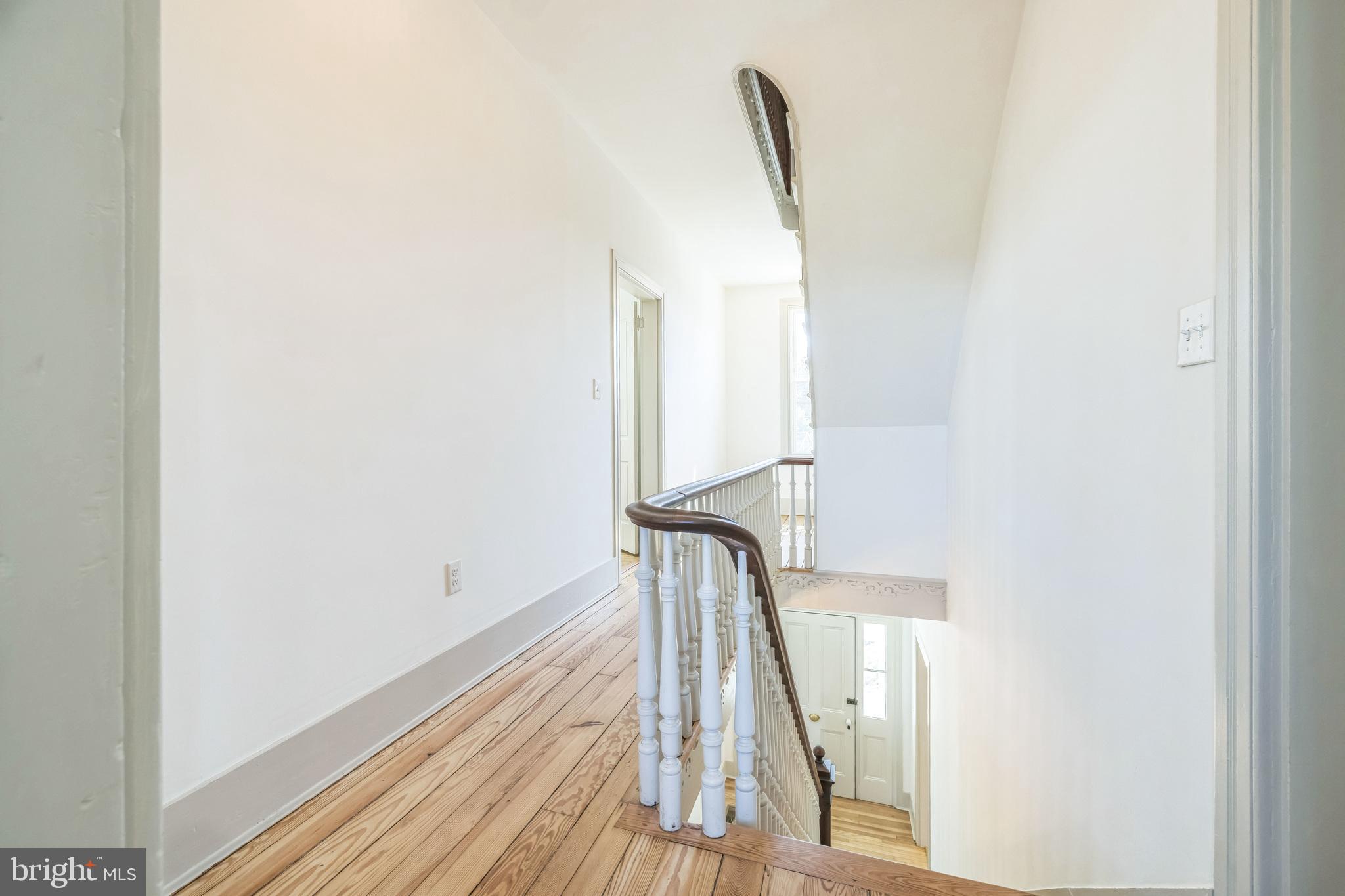 3860 Main Street Trappe, MD 21673 - Photo 44 of 58 a view of a hallway with wooden floor