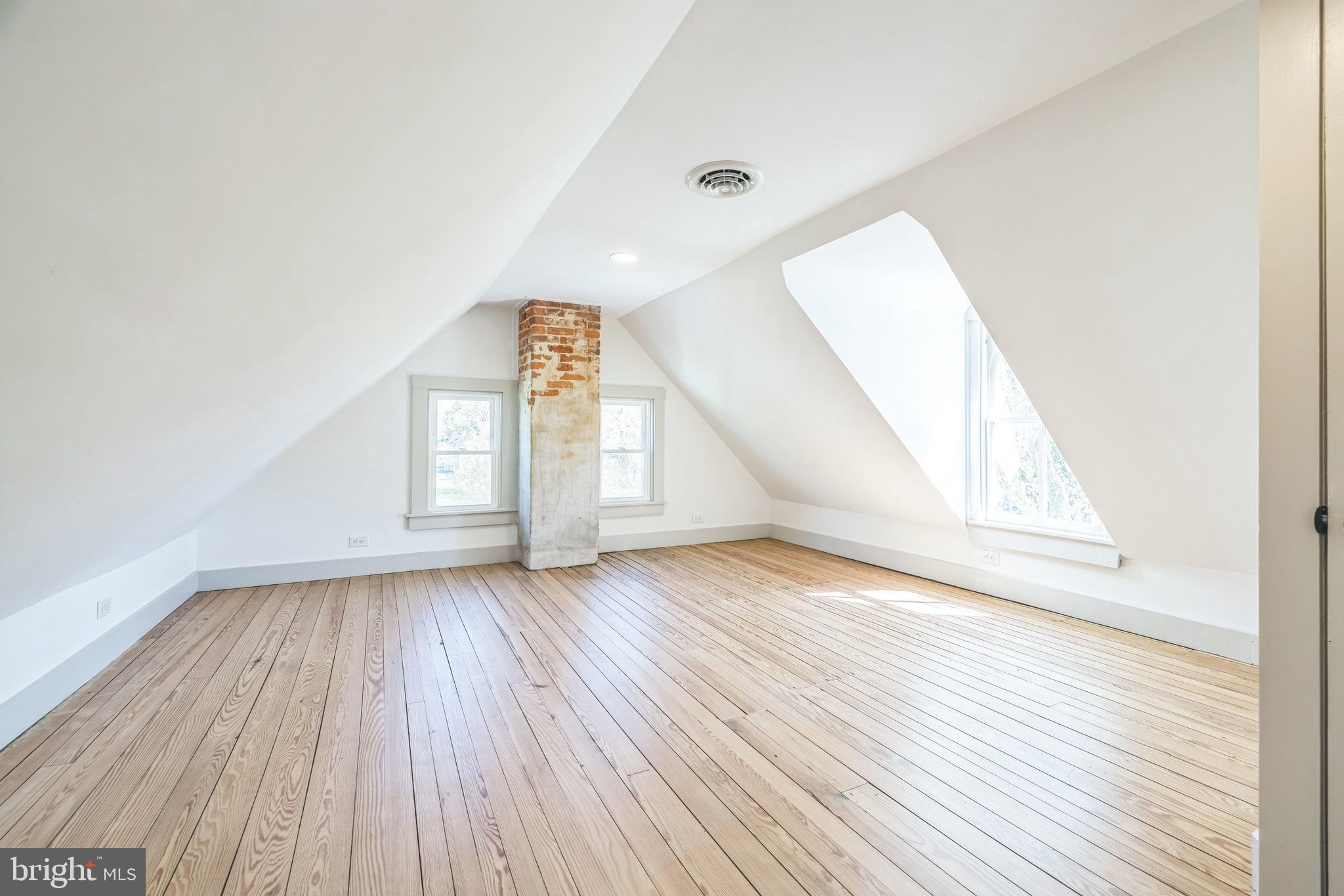3860 Main Street Trappe, MD 21673 - Photo 45 of 58 an empty room with wooden floor and windows
