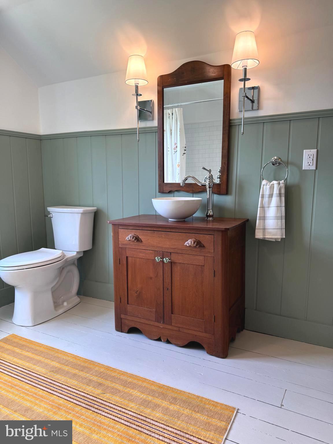 3860 Main Street Trappe, MD 21673 - Photo 46 of 58 a bathroom with a toilet sink and mirror