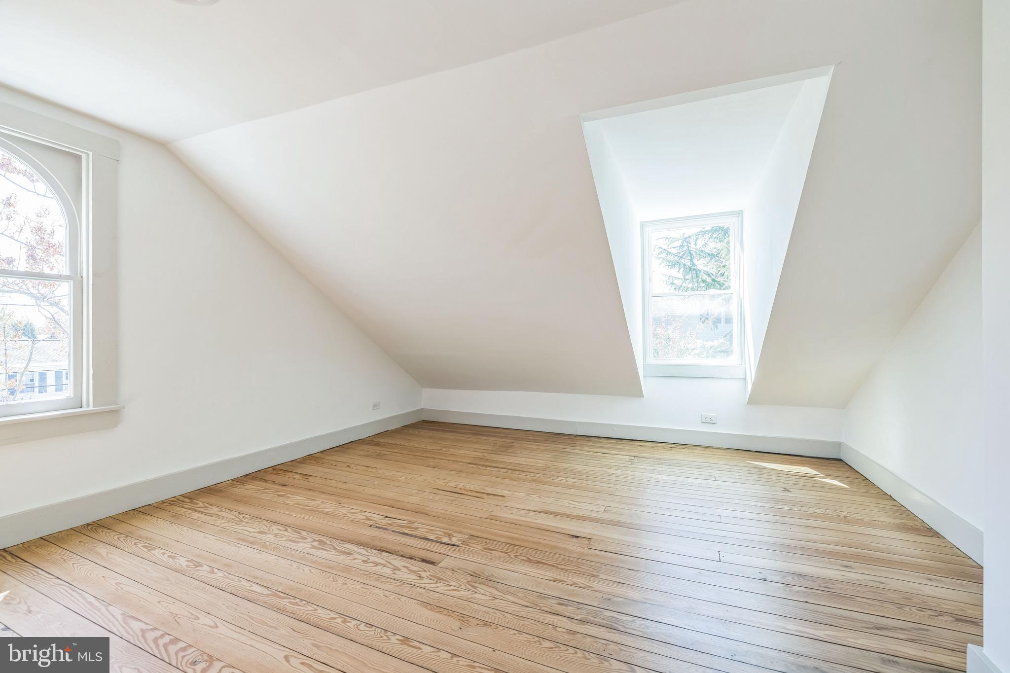 3860 Main Street Trappe, MD 21673 - Photo 47 of 58 an empty room with wooden floor and windows