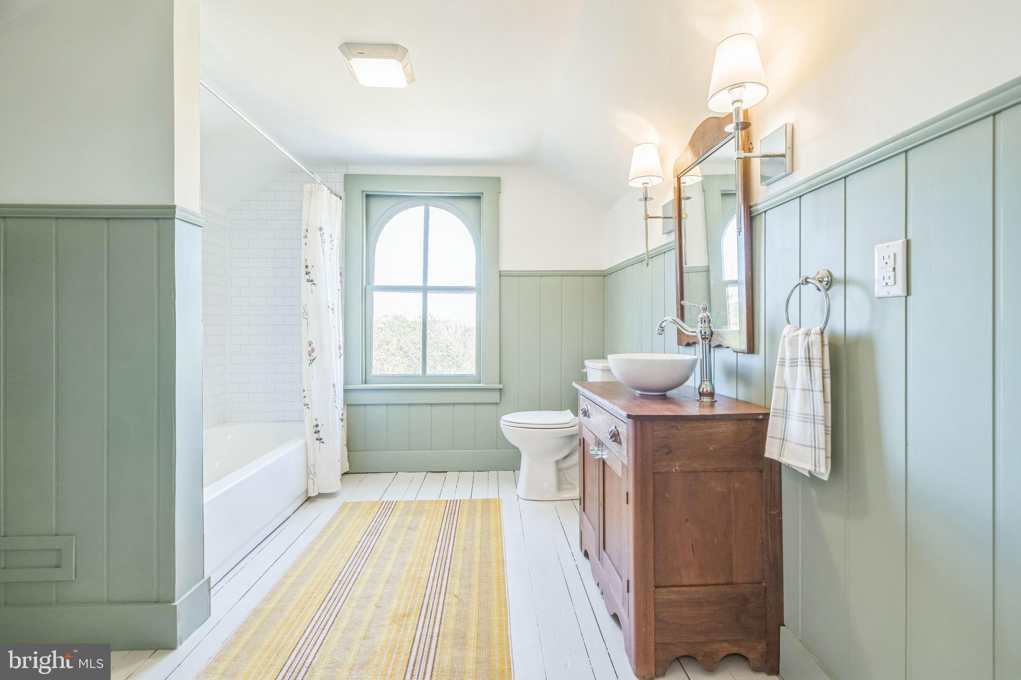 3860 Main Street Trappe, MD 21673 - Photo 48 of 58 a bathroom with a bathtub sink and toilet