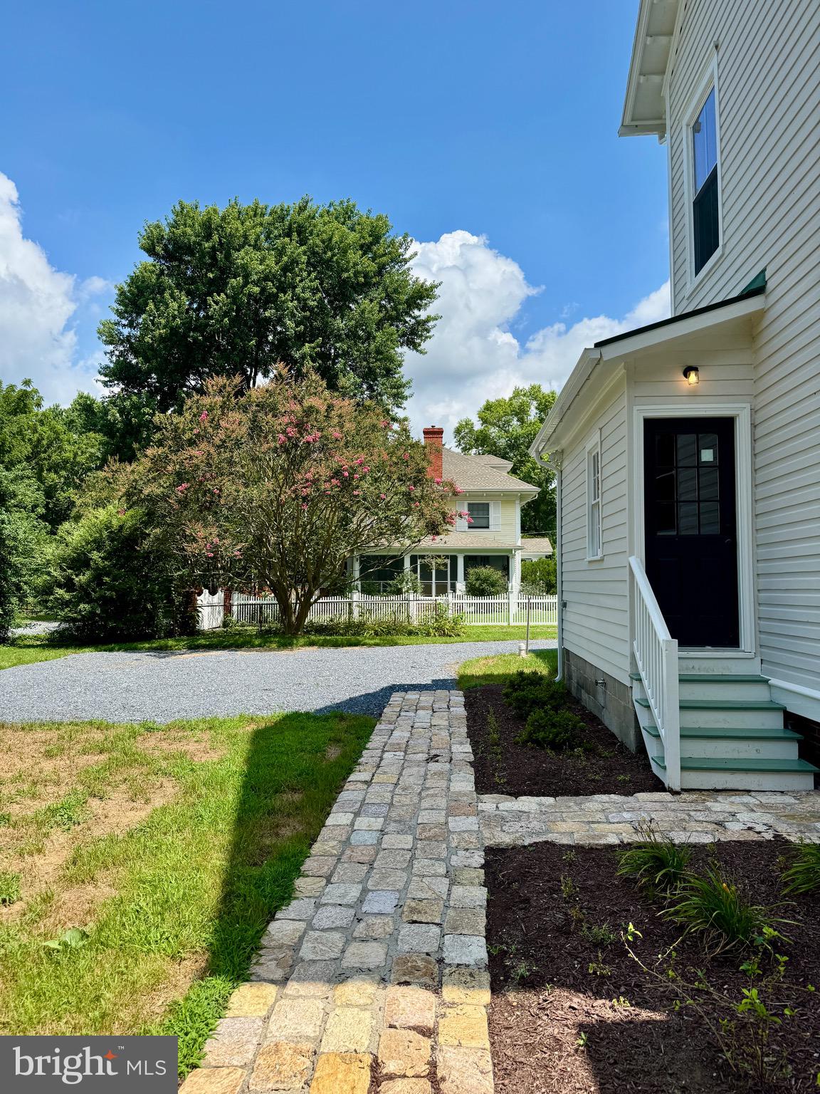 3860 Main Street Trappe, MD 21673 - Photo 50 of 58 a front view of a house with garden
