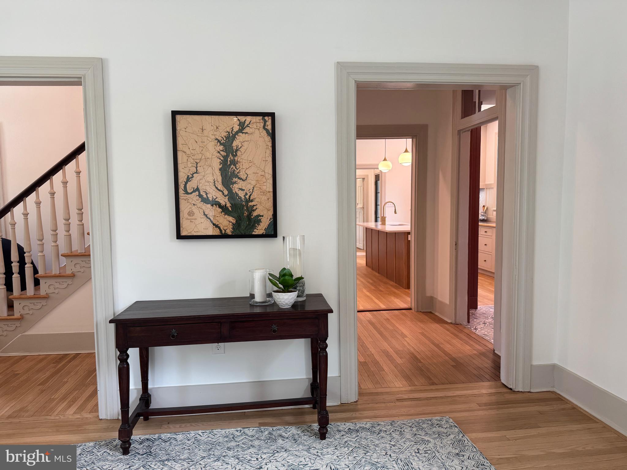 3860 Main Street Trappe, MD 21673 - Photo 6 of 58 a living room with a couch and a potted plant