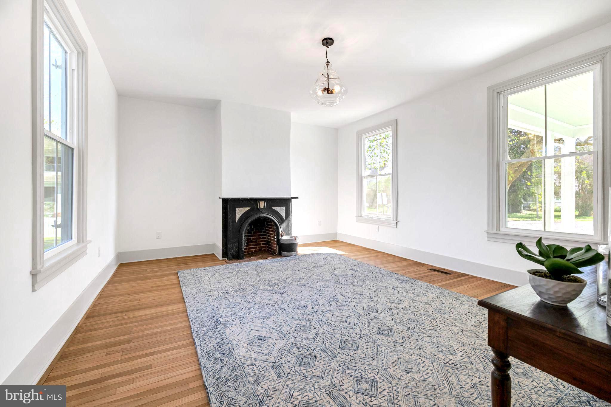 3860 Main Street Trappe, MD 21673 - Photo 8 of 58 a view of a livingroom with a fireplace and window