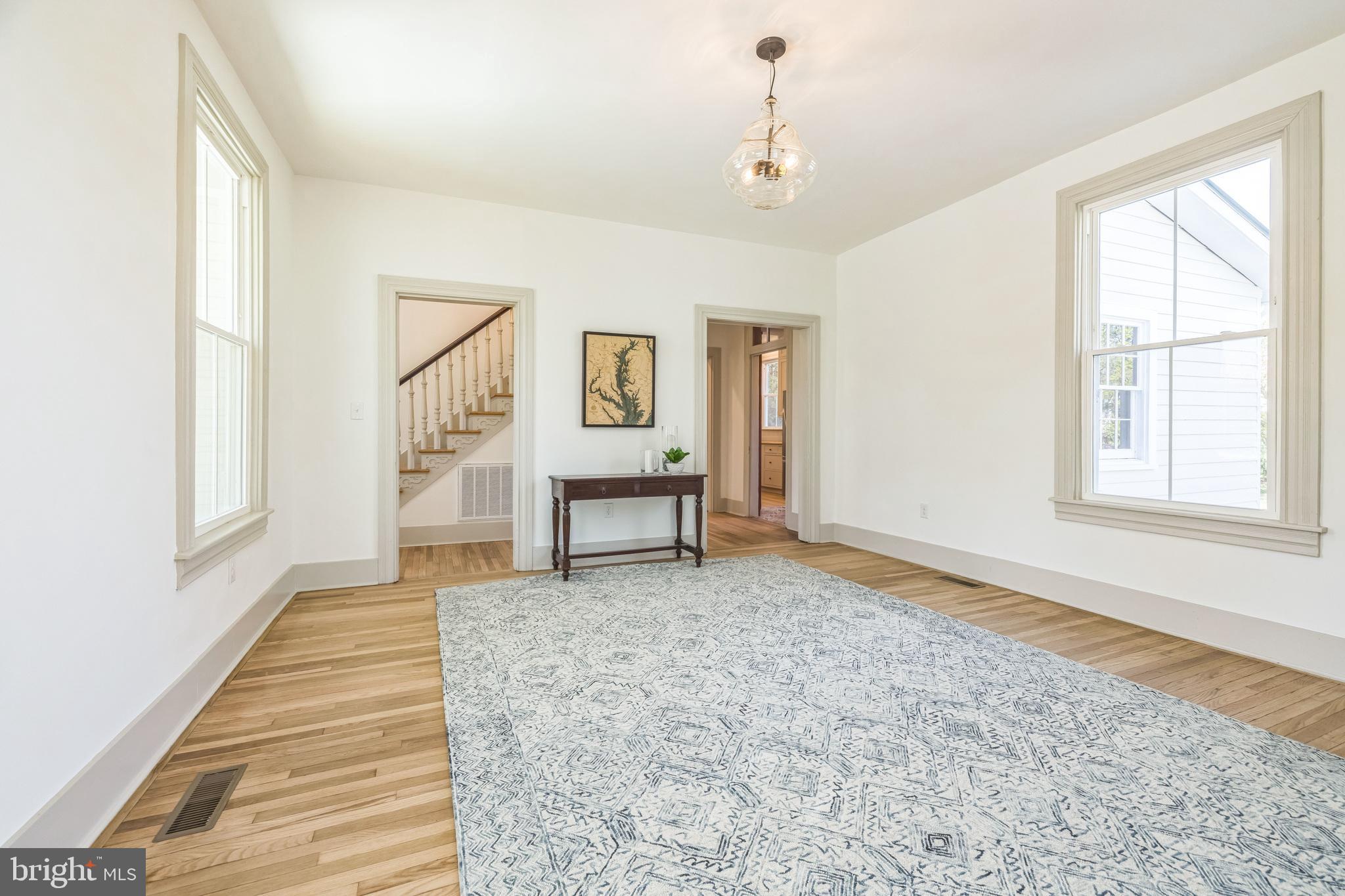 3860 Main Street Trappe, MD 21673 - Photo 9 of 58 a spacious bedroom with a bed and a window