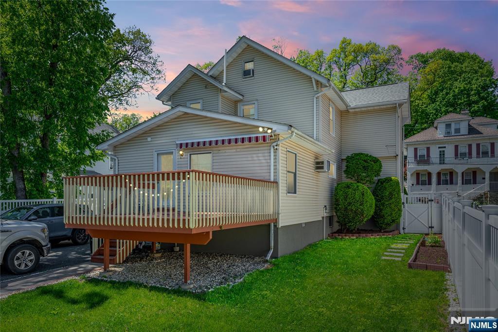 690 Garden Street Maywood, NJ 07607 - Photo 43 of 49 a front view of a house with a garden and deck