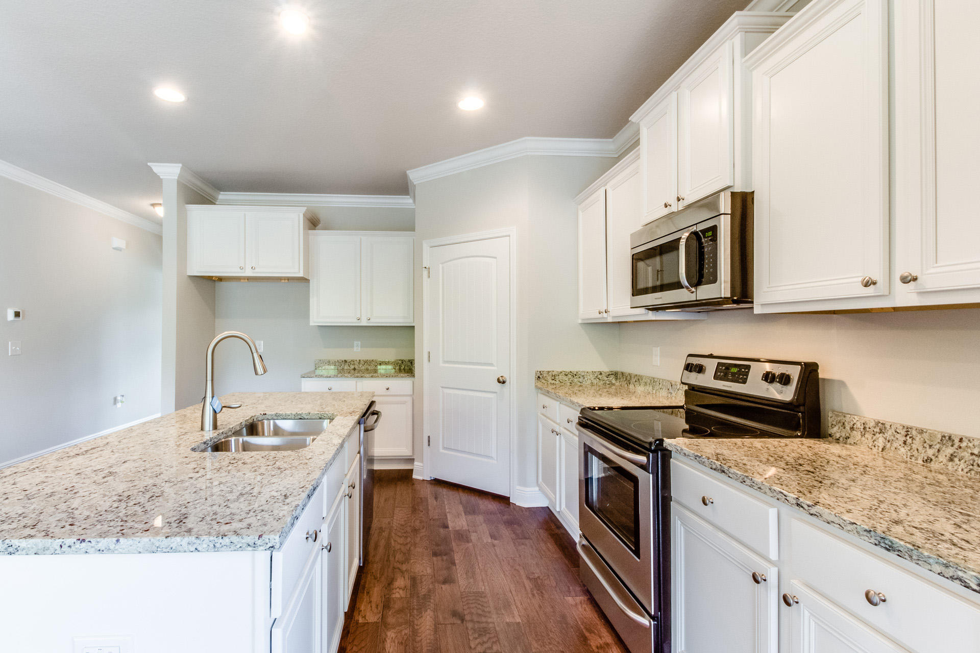 600 Las Roblas Grande Drive Santa Rosa Beach, FL 32459 - Photo 3 of 12 a kitchen with stainless steel appliances granite countertop a sink stove microwave and refrigerator