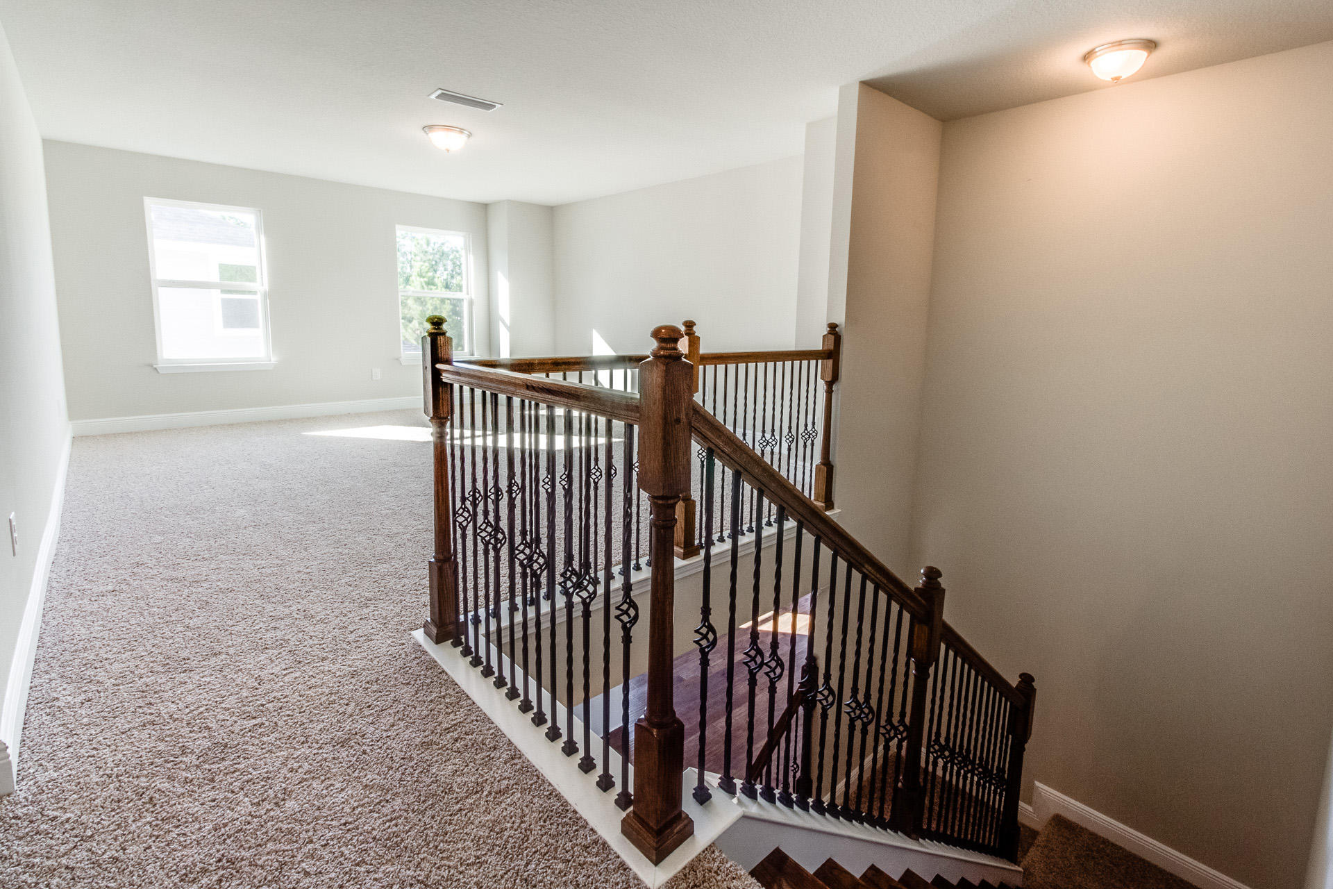 600 Las Roblas Grande Drive Santa Rosa Beach, FL 32459 - Photo 5 of 12 a view of staircase with railing and a window