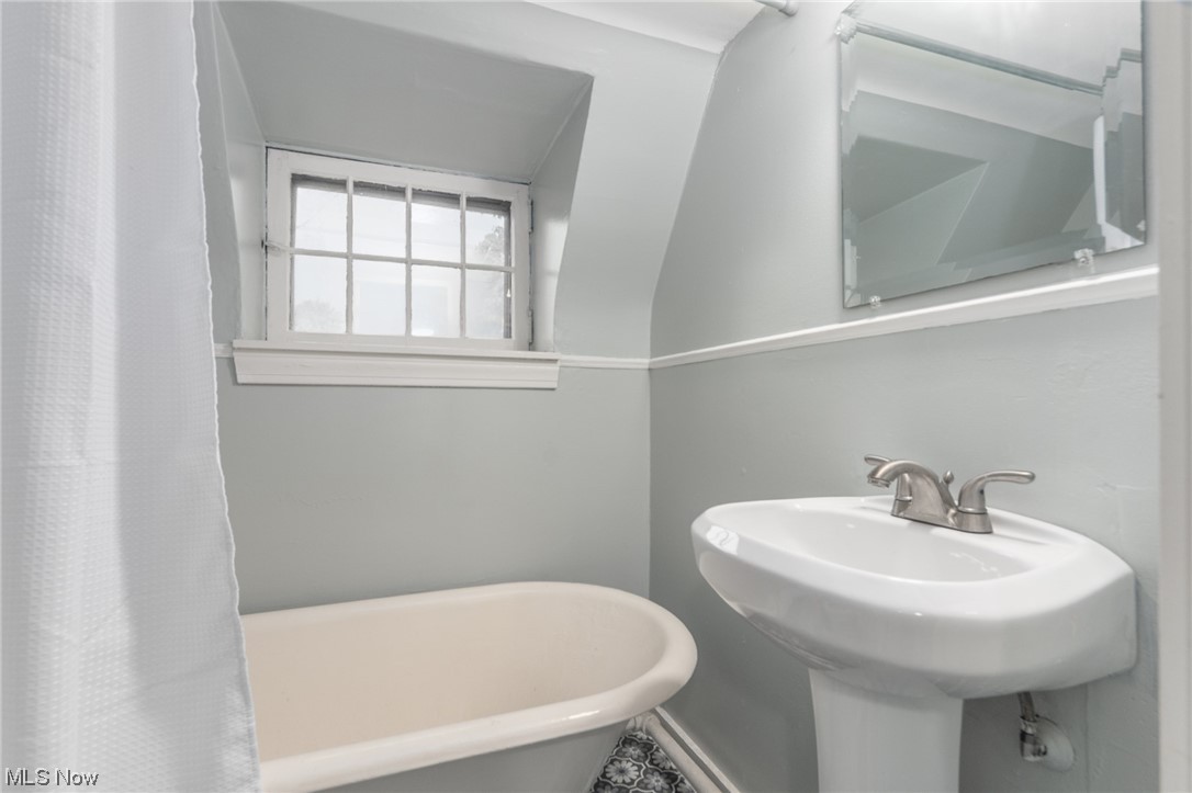 2482 Charney Road Cleveland, OH 44118 - Photo 24 of 34 Bathroom featuring sink and a bathtub