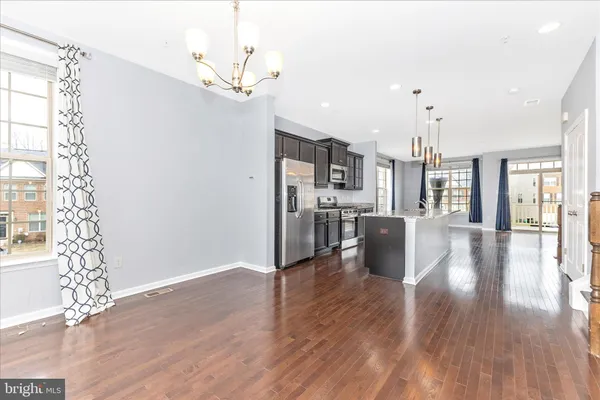a view of a kitchen with wooden floor