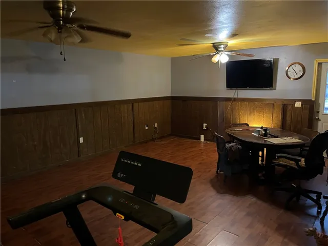 a view of a hallway with entryway wooden floor and chandelier