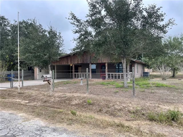 a house with trees in the background
