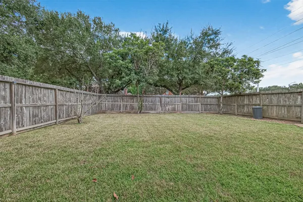a view of a backyard with a slide and a table and chairs