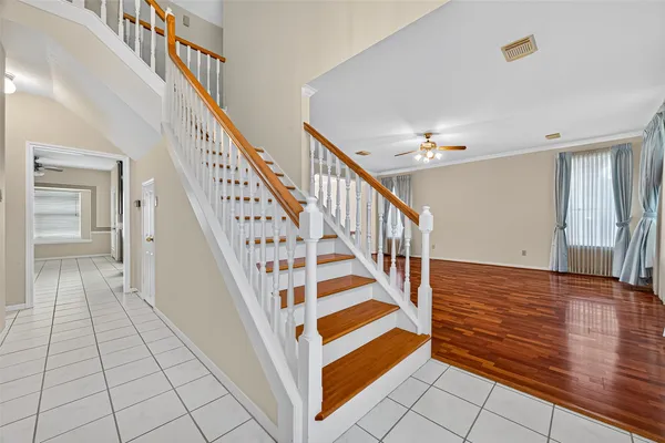 a view of entryway and hall with wooden floor