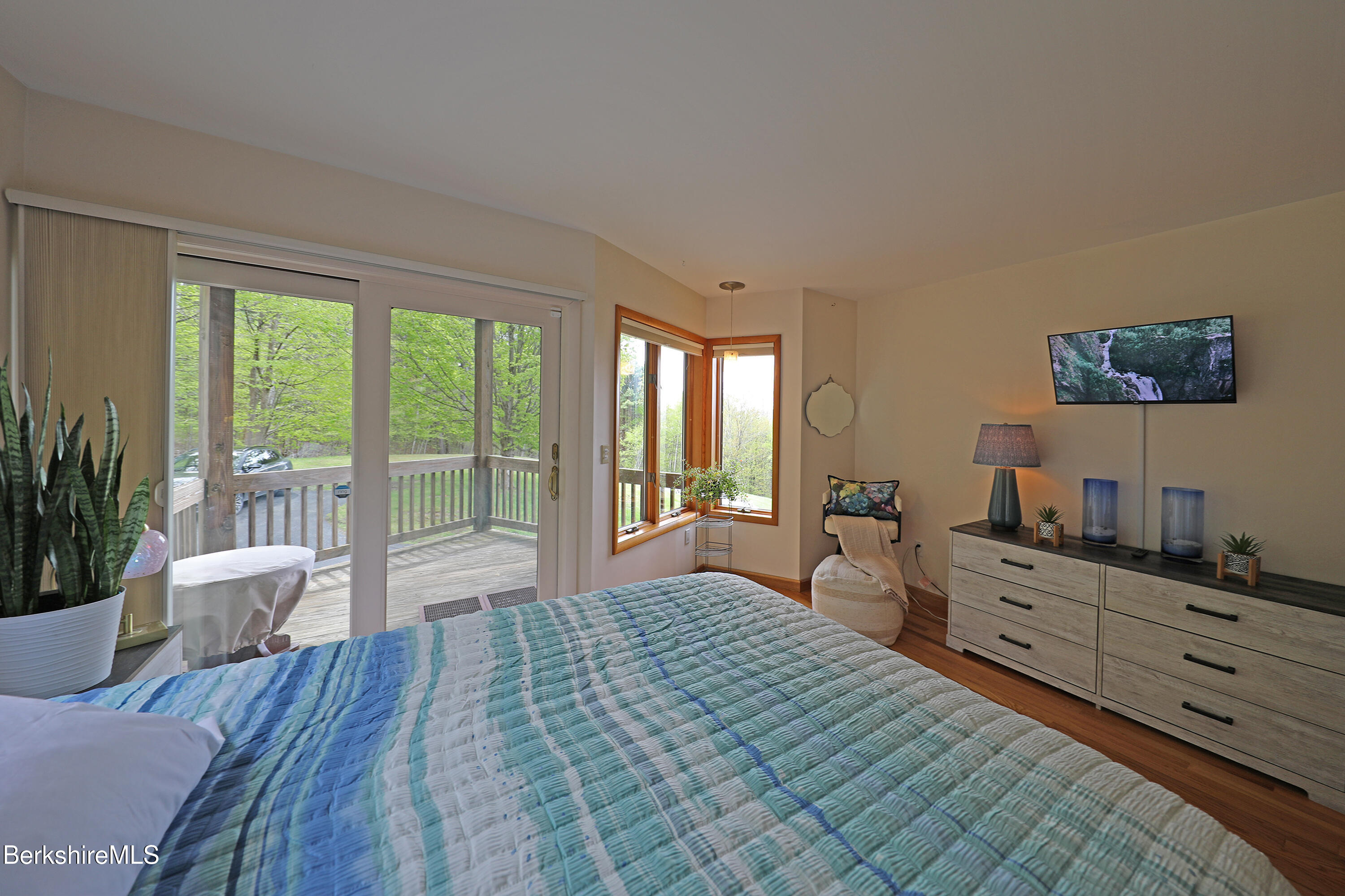 126 Temple Road New Lebanon, NY 12125 - Photo 10 of 37 a large bedroom with a large bed and a large window