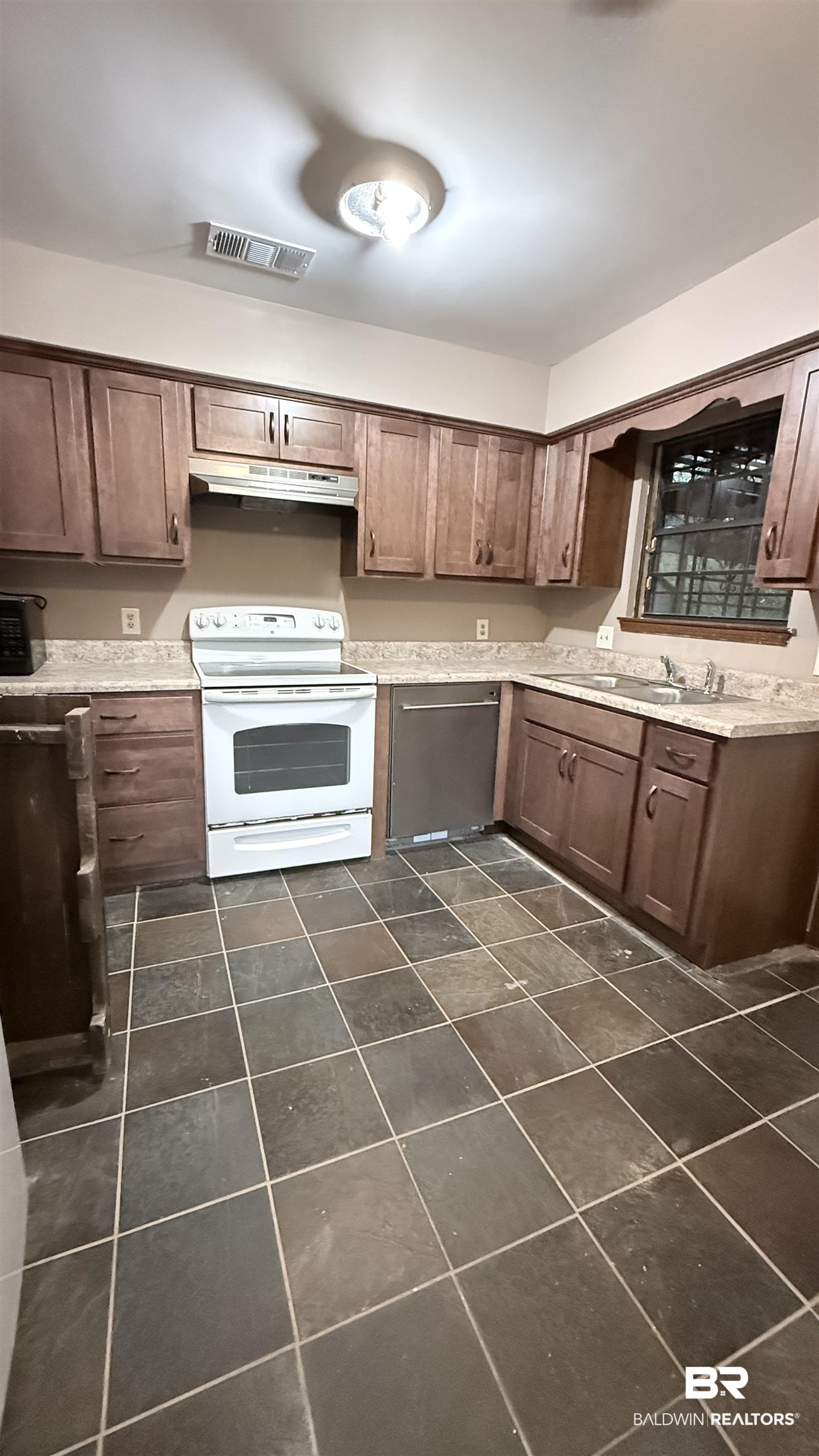 4131 Springdale Road Mobile, AL 36609 - Photo 3 of 28 Kitchen with white range with electric stovetop, dishwasher, under cabinet range hood, and dark brown cabinetry