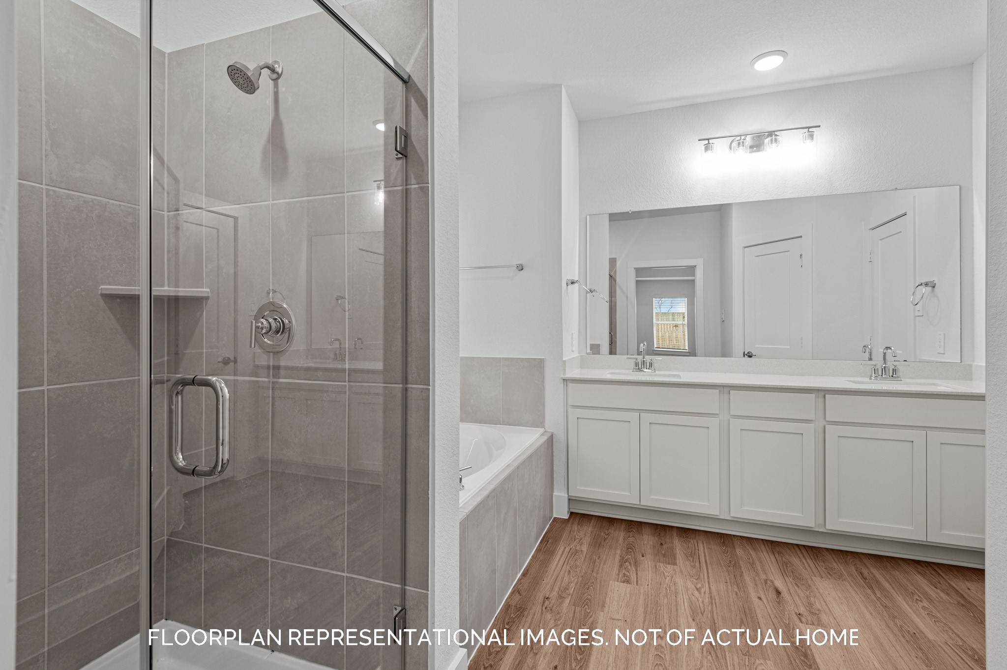 5707 Sunland Trail Fulshear, TX 77441 - Photo 14 of 21 a spacious bathroom with a shower a sink and a mirror