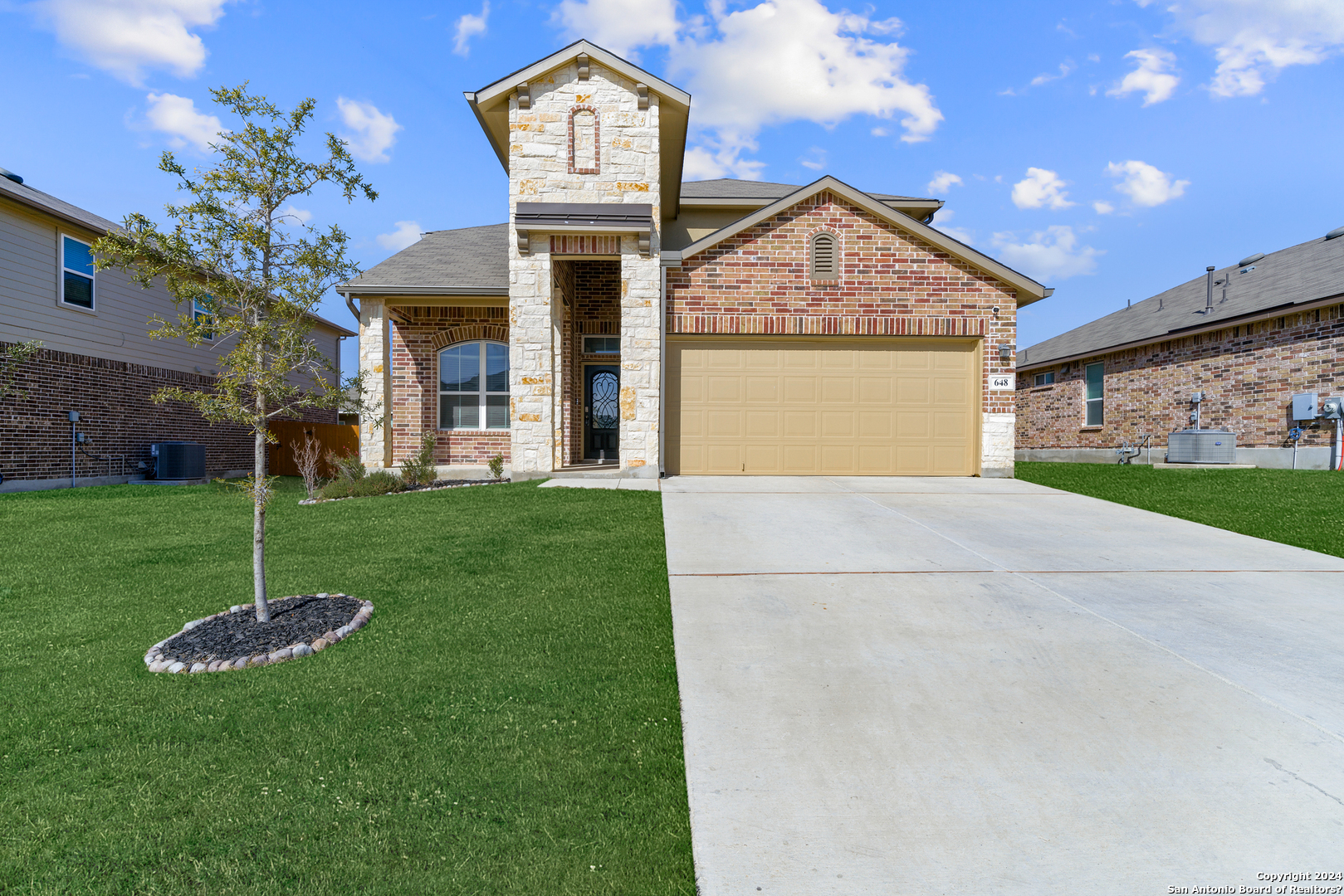 648 Amber Creek Cibolo, TX 78108 - Photo 1 of 34 a front view of a house with garden