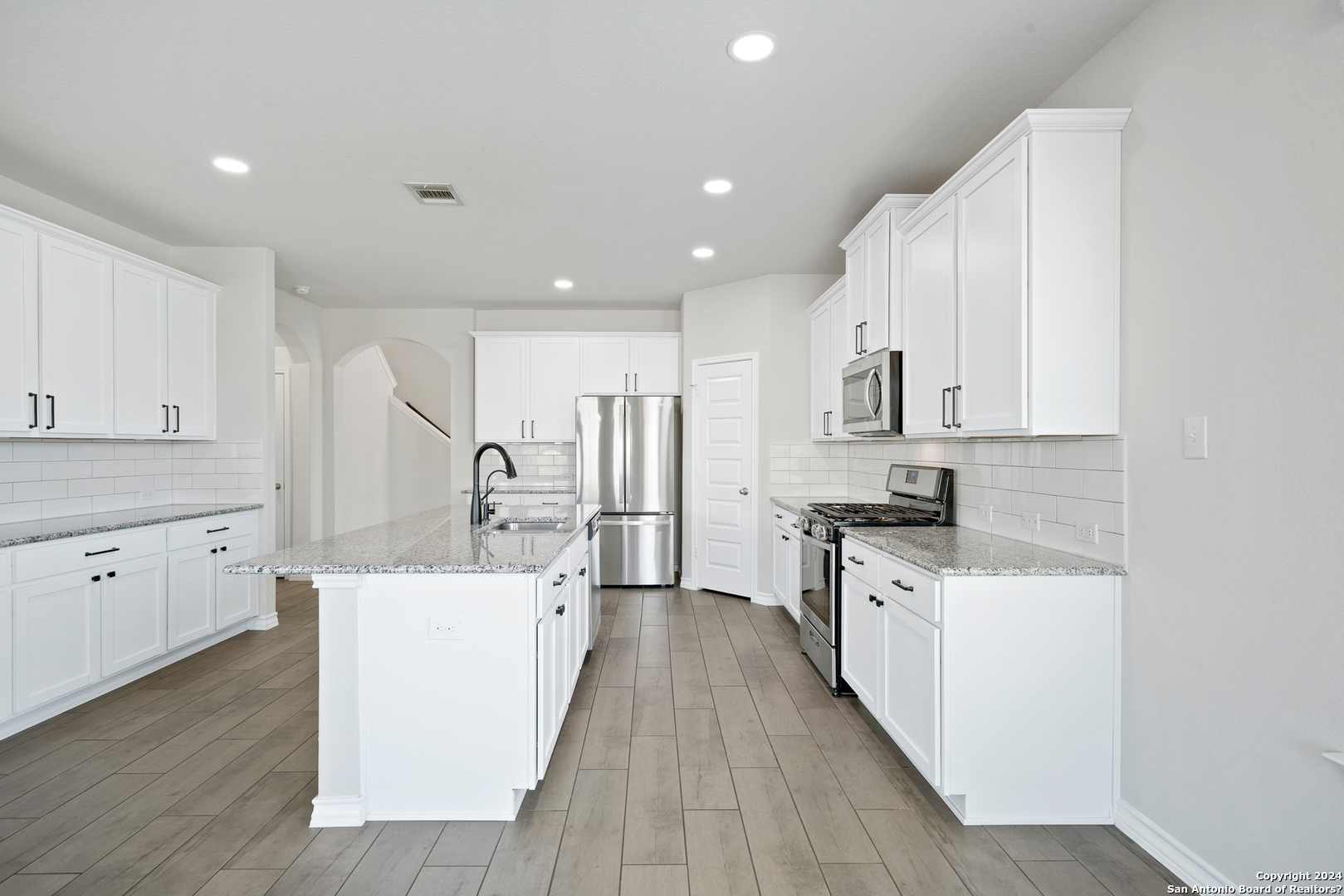 648 Amber Creek Cibolo, TX 78108 - Photo 13 of 34 a kitchen with white cabinets appliances and sink