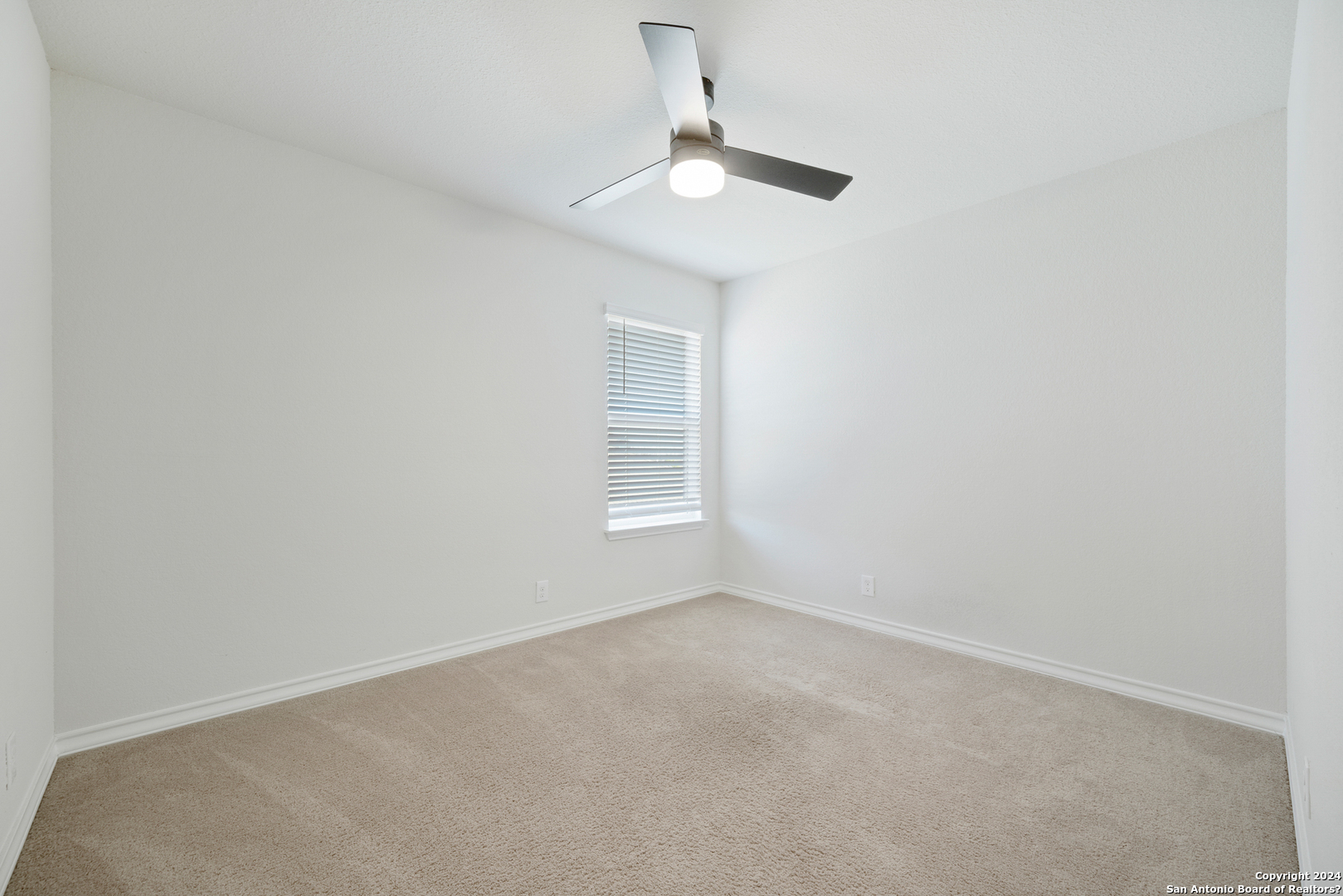 648 Amber Creek Cibolo, TX 78108 - Photo 29 of 34 an empty room with a window and a fan