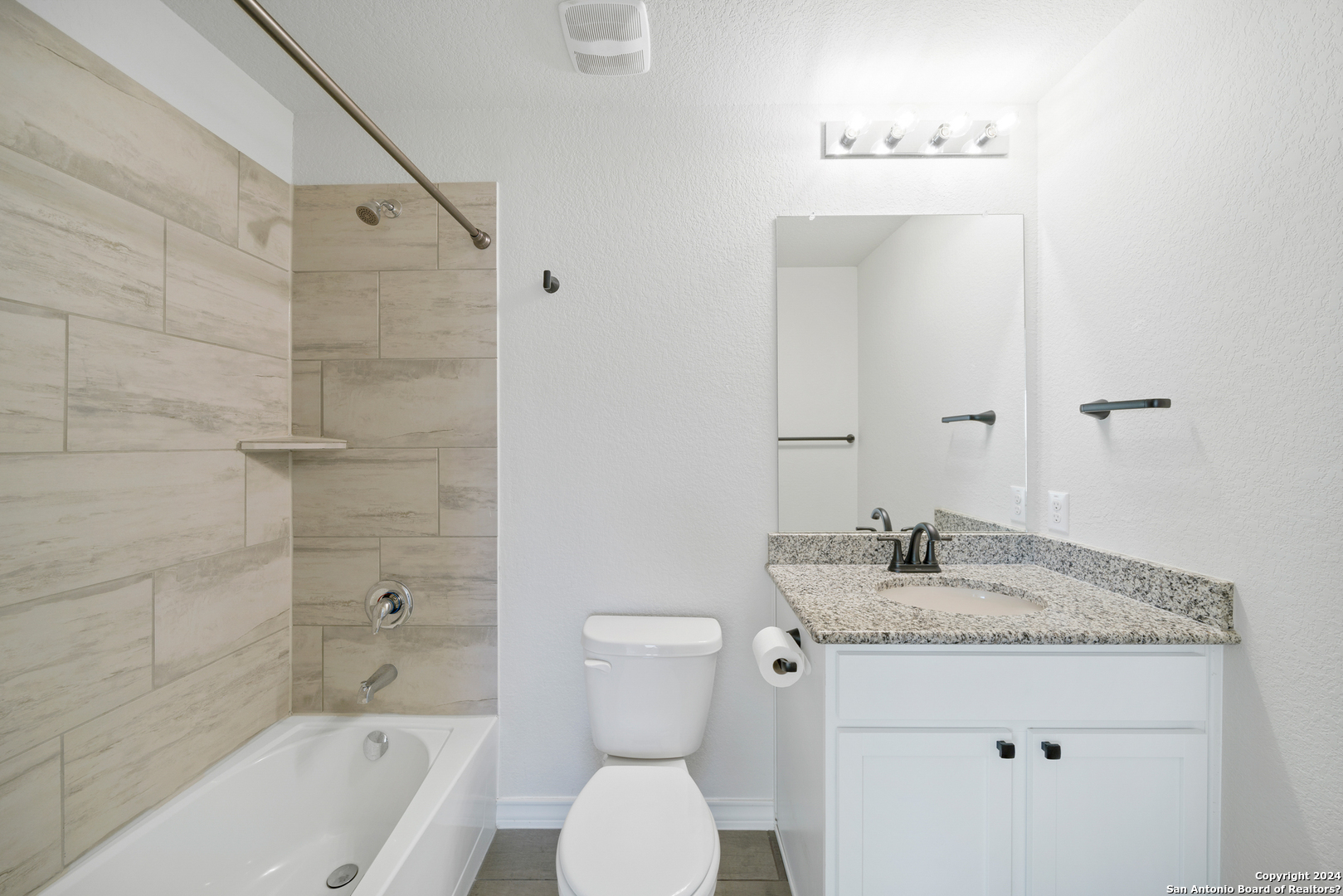 648 Amber Creek Cibolo, TX 78108 - Photo 31 of 34 a bathroom with a granite countertop sink toilet and shower