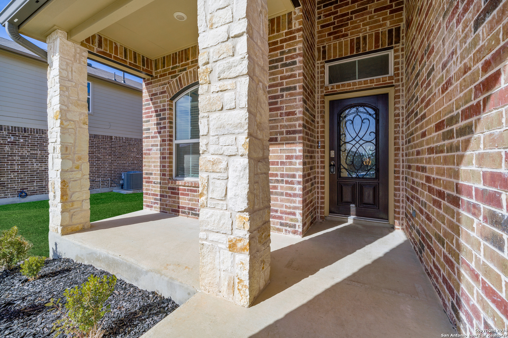 648 Amber Creek Cibolo, TX 78108 - Photo 4 of 34 a front view of a house with a garden