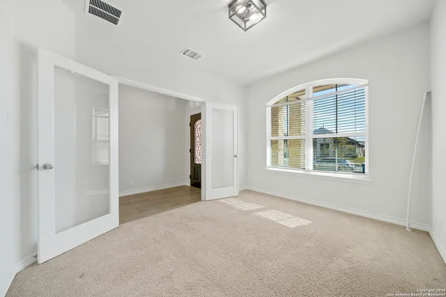 a view of an empty room with a window