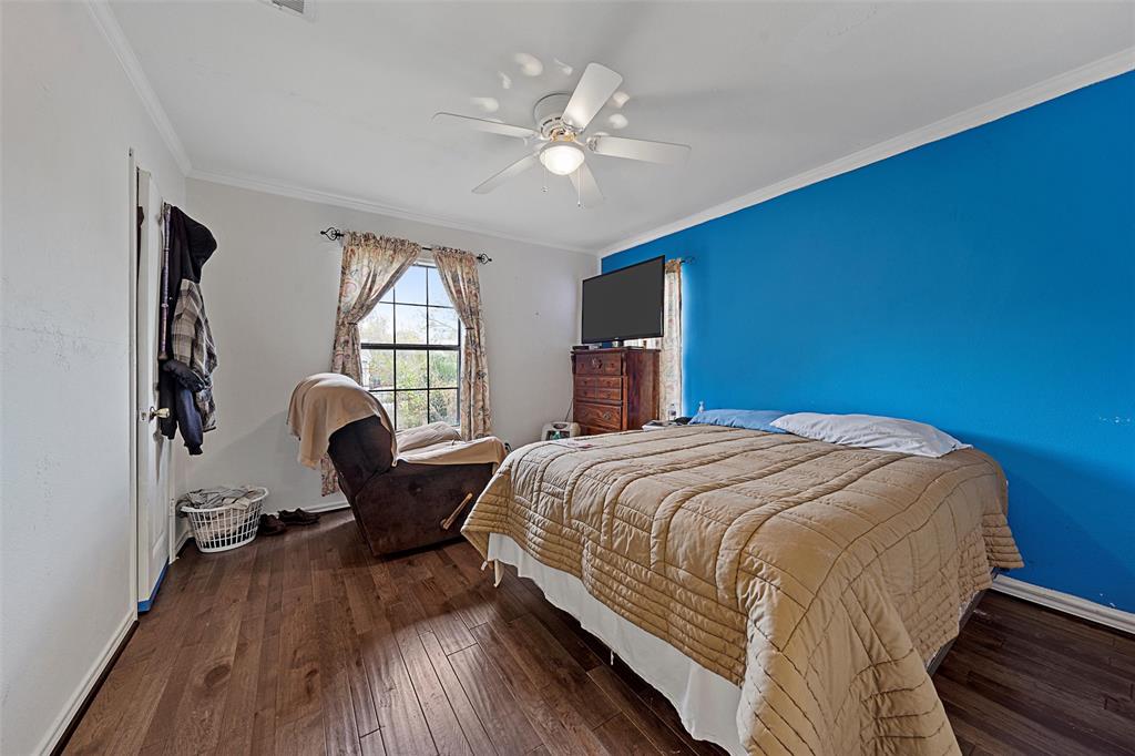 1917 Bell Street Waco, TX 76711 - Photo 13 of 17 a bedroom with a bed and window