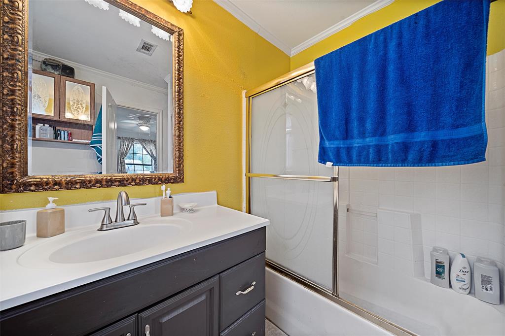 1917 Bell Street Waco, TX 76711 - Photo 14 of 17 a bathroom with a sink and a mirror