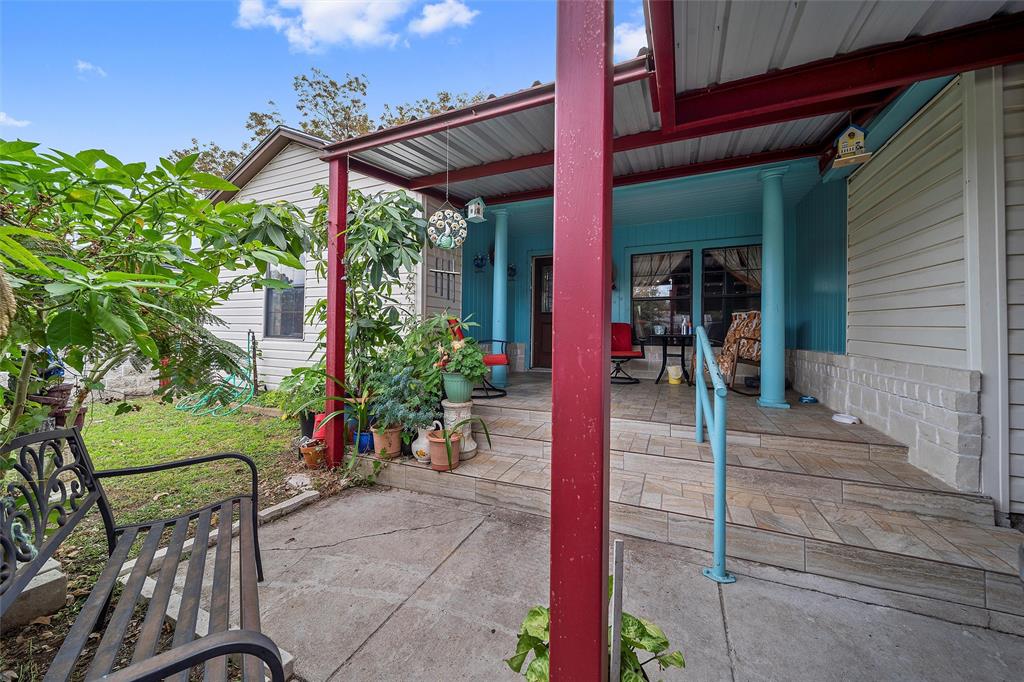 1917 Bell Street Waco, TX 76711 - Photo 3 of 17 a view of a patio with table and chairs potted plants