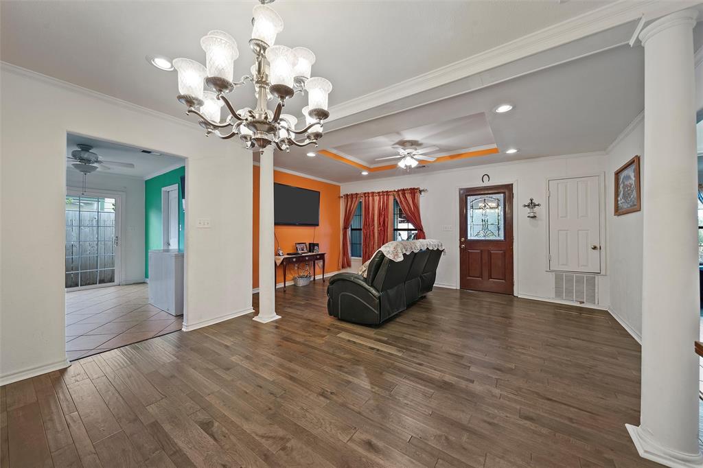 1917 Bell Street Waco, TX 76711 - Photo 5 of 17 a living room with hard wood flooring and a chandelier