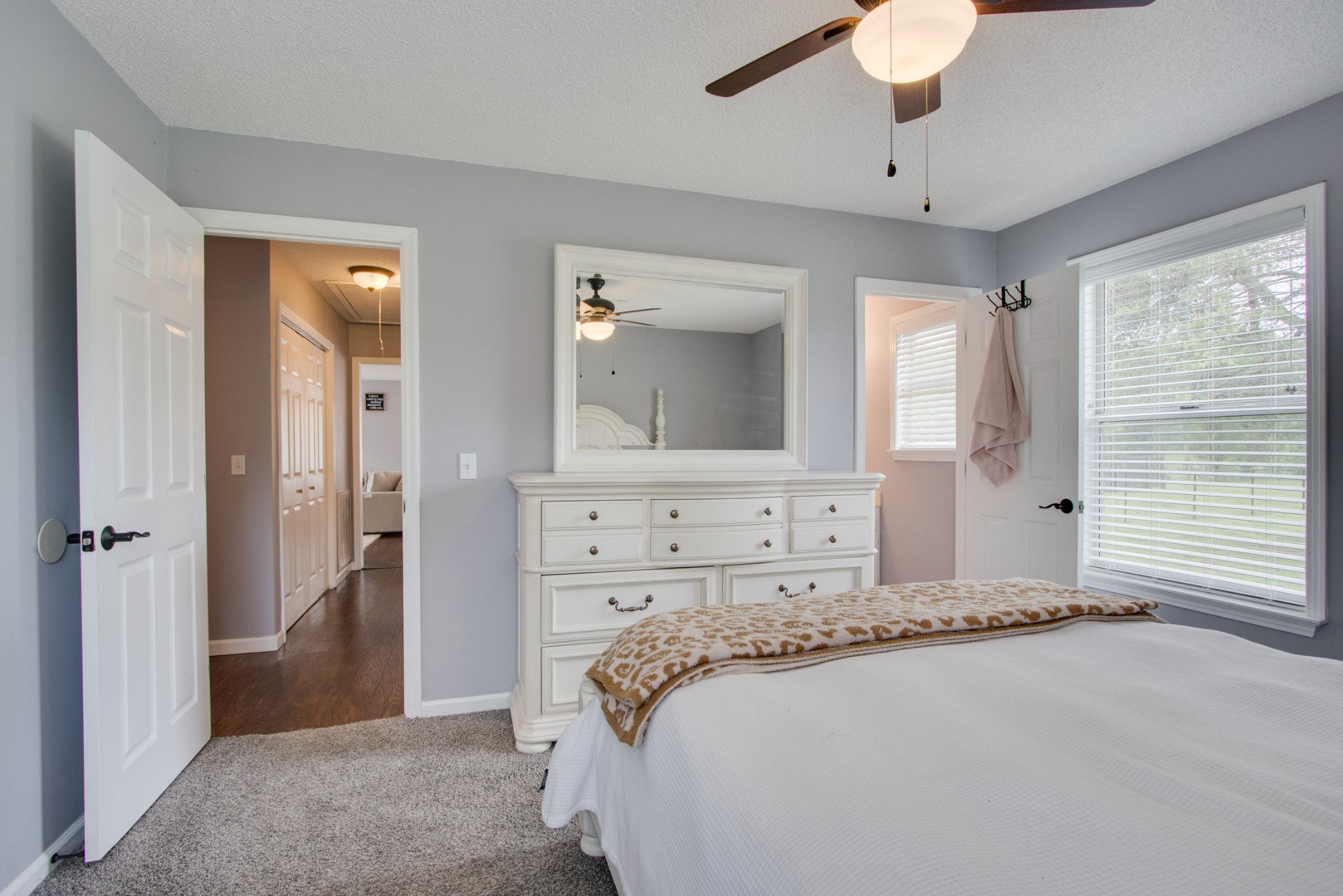 576 Bellwood Road Lebanon, TN 37087 - Photo 25 of 34 a spacious bedroom with a large bed and a chandelier