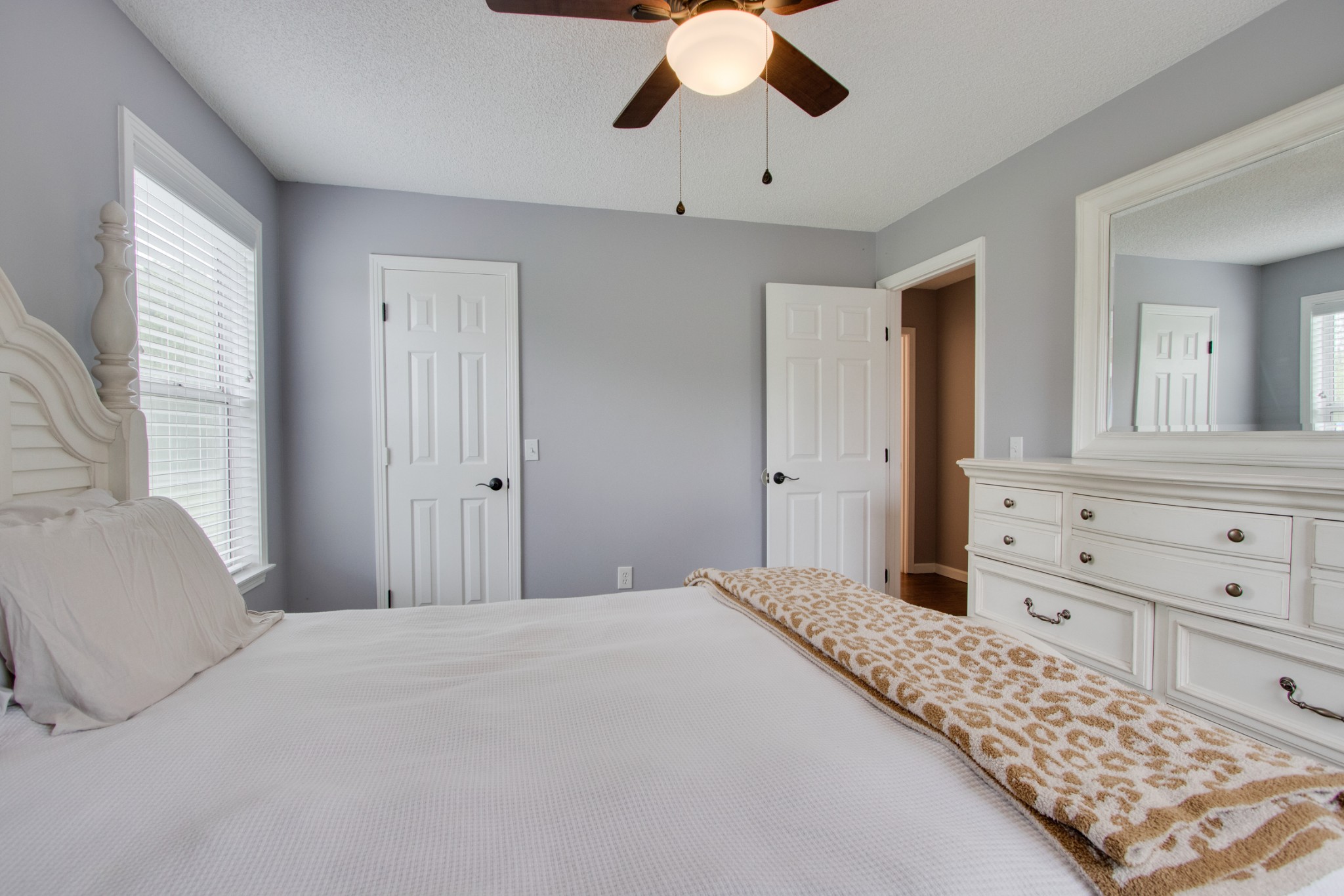 576 Bellwood Road Lebanon, TN 37087 - Photo 26 of 34 a bedroom with a large bed and a chandelier