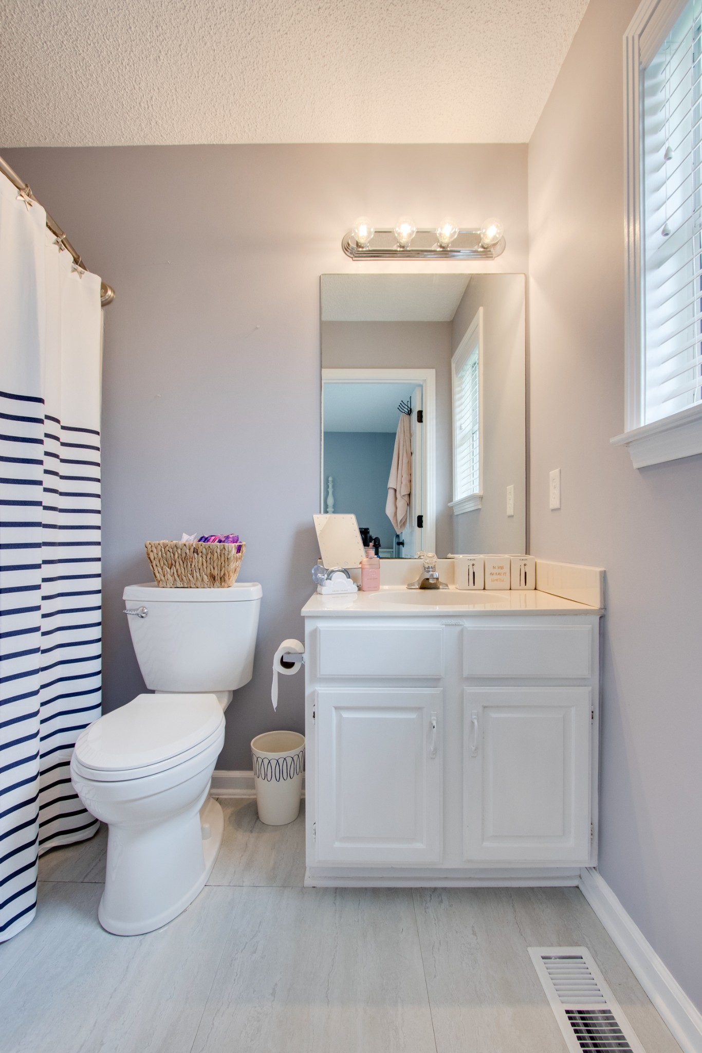 576 Bellwood Road Lebanon, TN 37087 - Photo 27 of 34 a bathroom with a sink toilet mirror and vanity