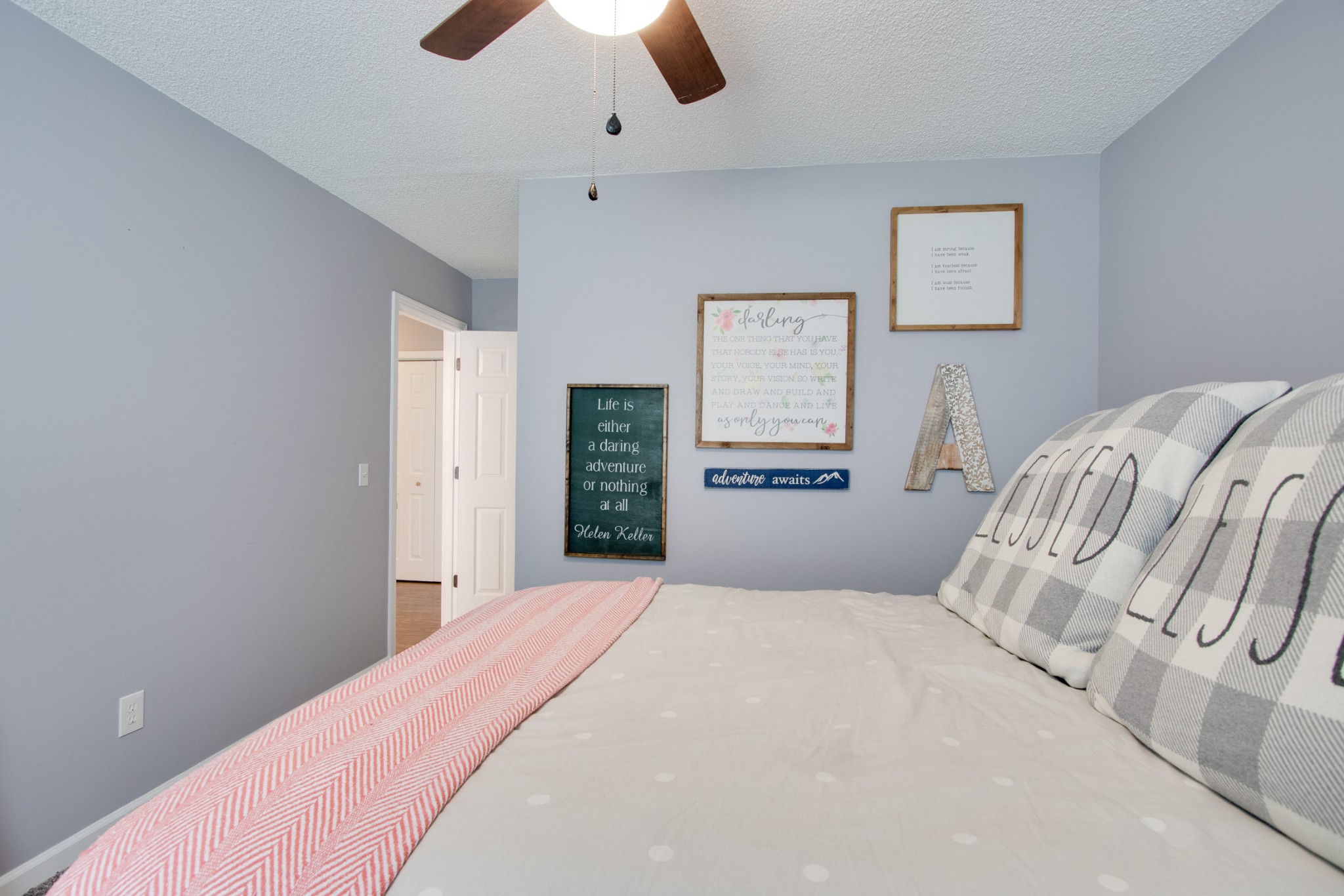 576 Bellwood Road Lebanon, TN 37087 - Photo 29 of 34 a bedroom with a bed and a chandelier