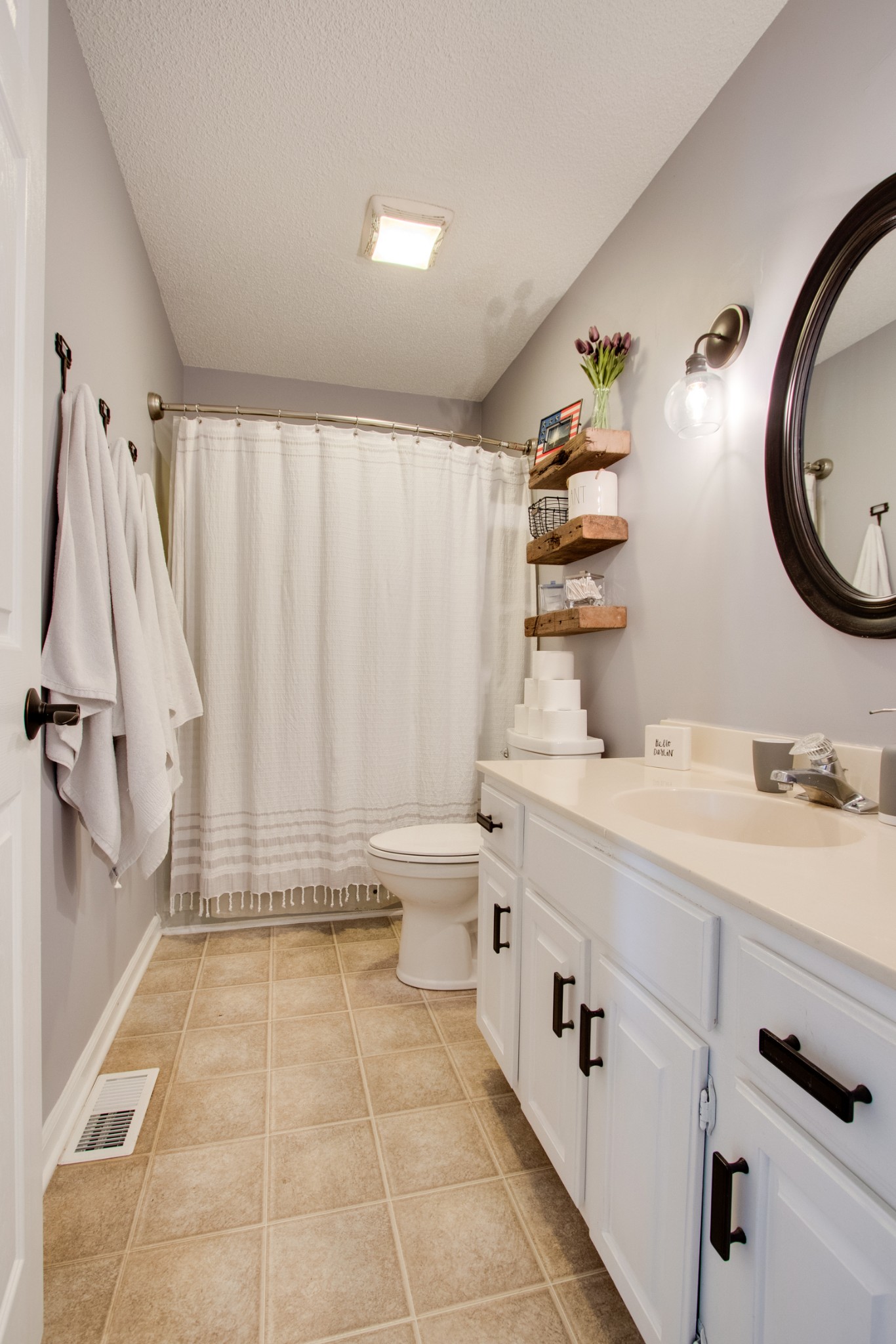 576 Bellwood Road Lebanon, TN 37087 - Photo 30 of 34 a spacious bathroom with a double vanity sink a mirror a bathtub and a shower