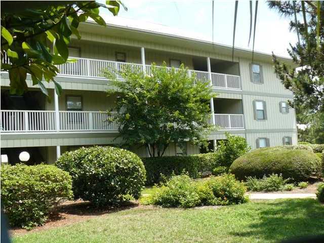 3799 Hwy Santa Rosa Beach, Unit 10B 30A Santa Rosa Beach, FL 32459 - Photo 2 of 16 a front view of a house with a yard