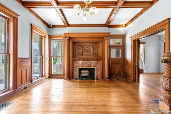 a view of livingroom with fireplace and wooden floor