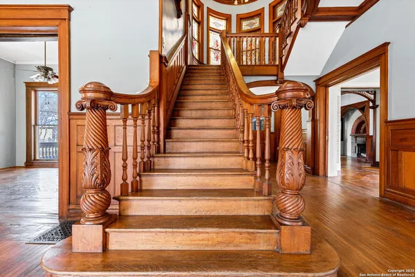 a view of a entryway door with wooden floor