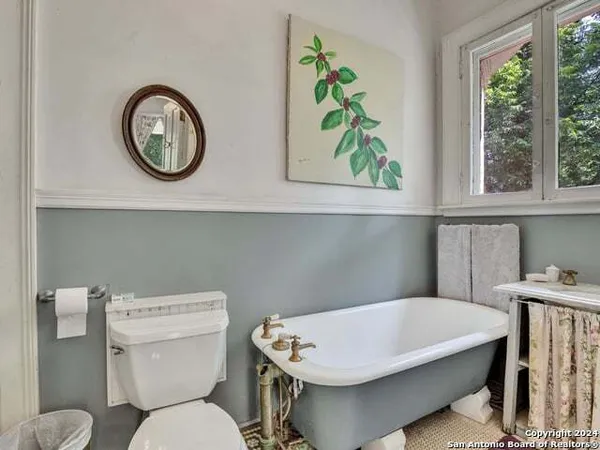 a view of a balcony with floor to ceiling windows and wooden floor