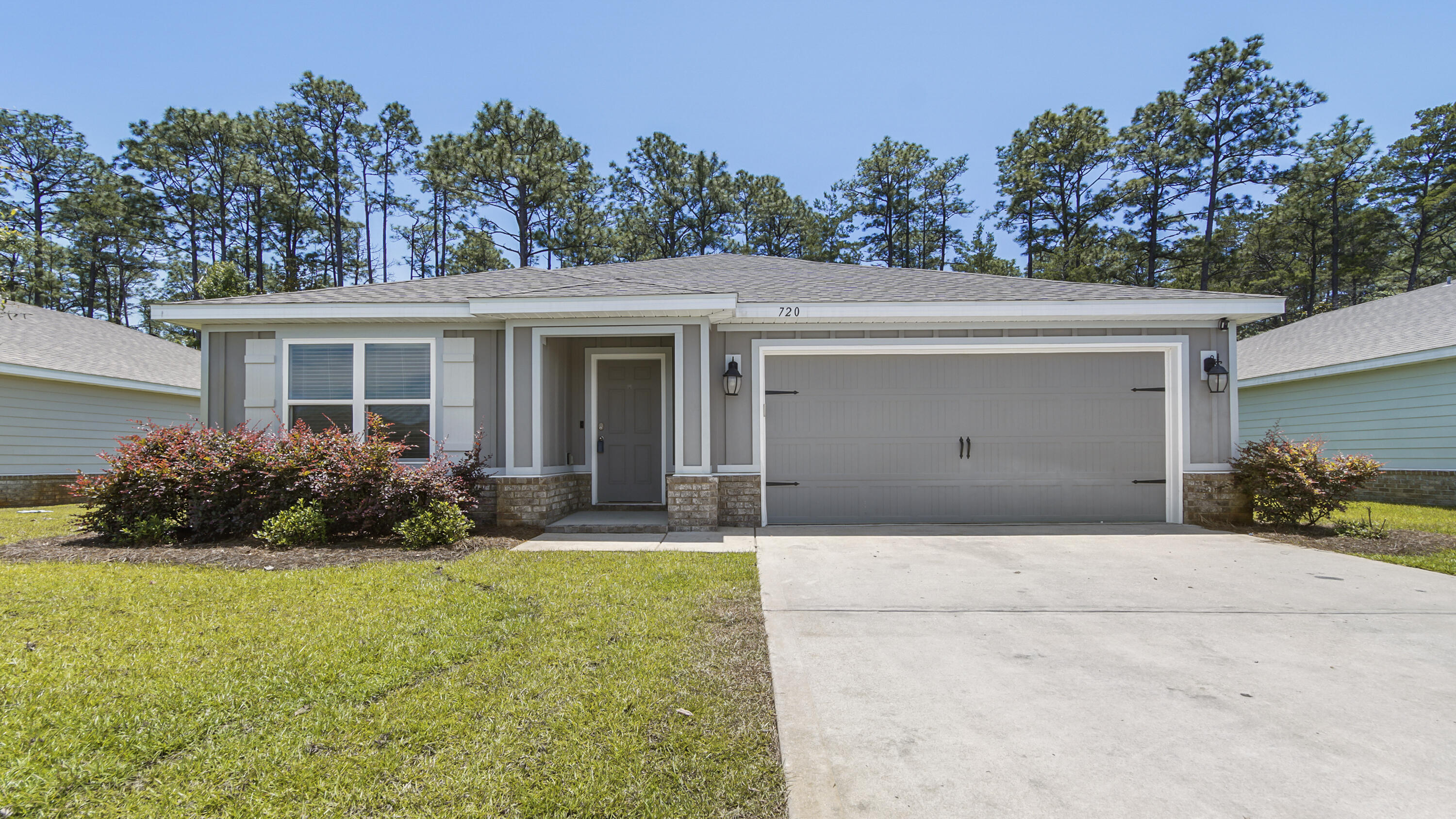 front view of a house with a small yard
