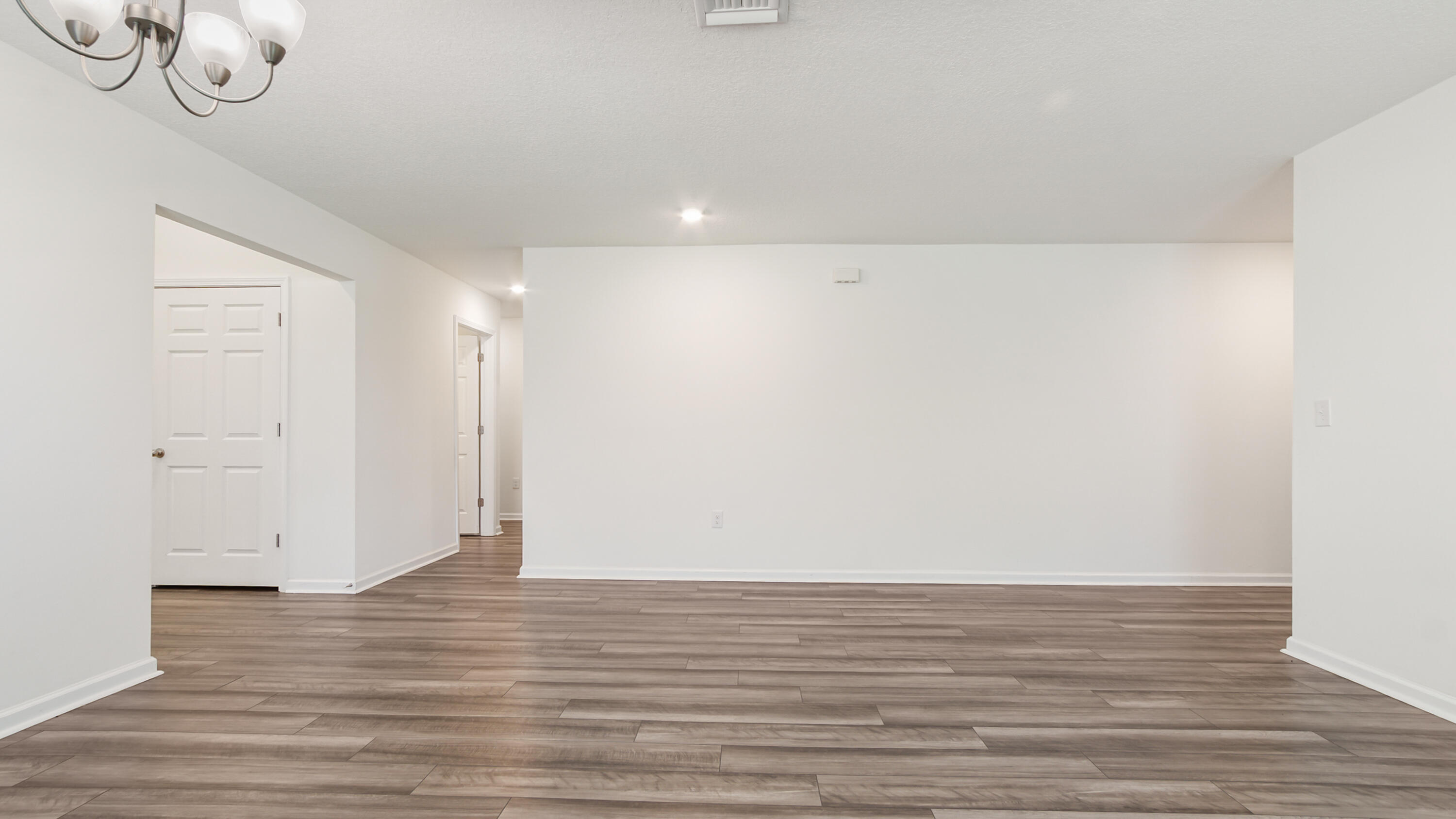 720 Riverwalk Circle Freeport, FL 32439 - Photo 14 of 50 a view of room with wooden floor
