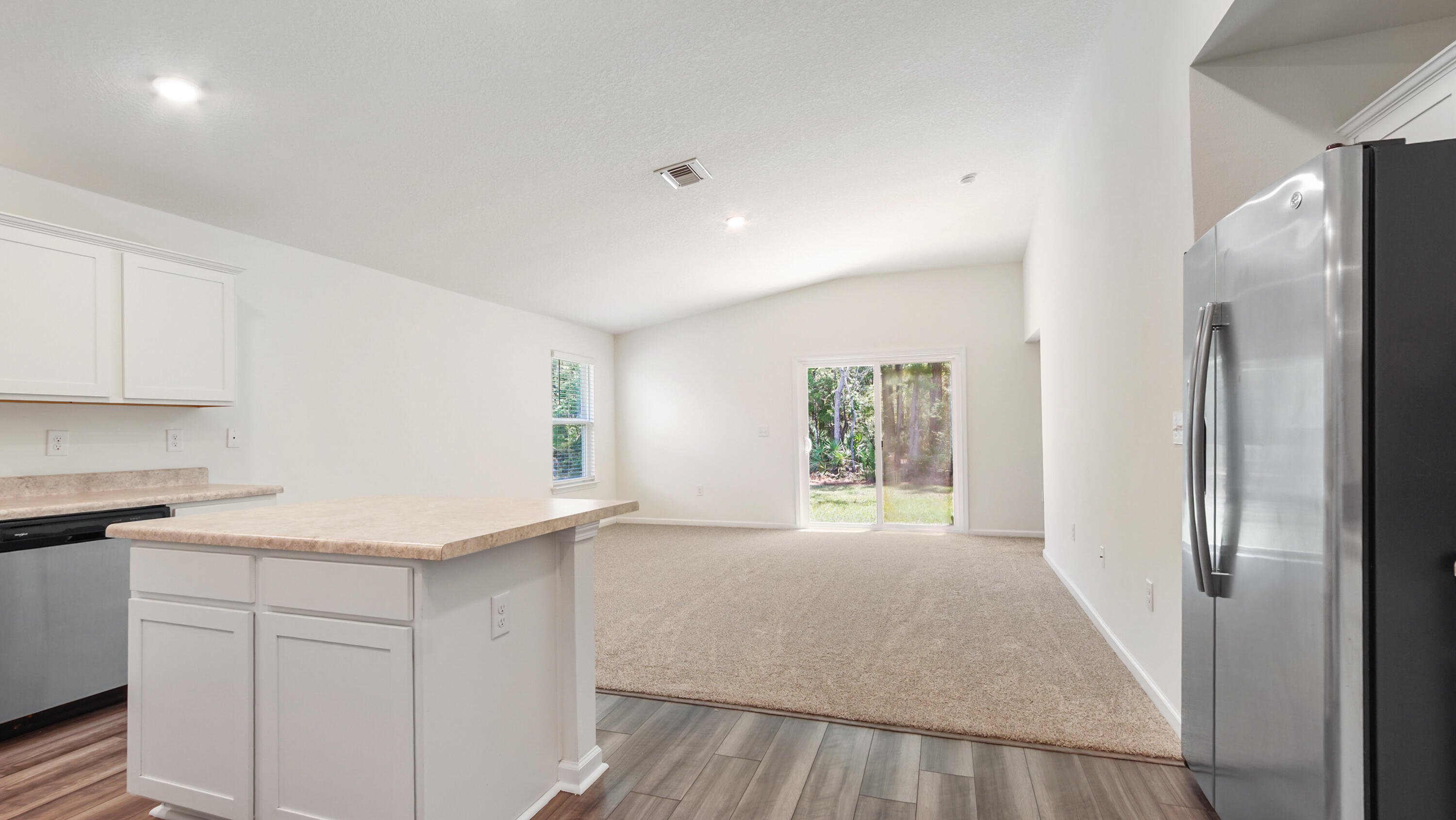 720 Riverwalk Circle Freeport, FL 32439 - Photo 25 of 50 a view of a kitchen with an empty space and a window