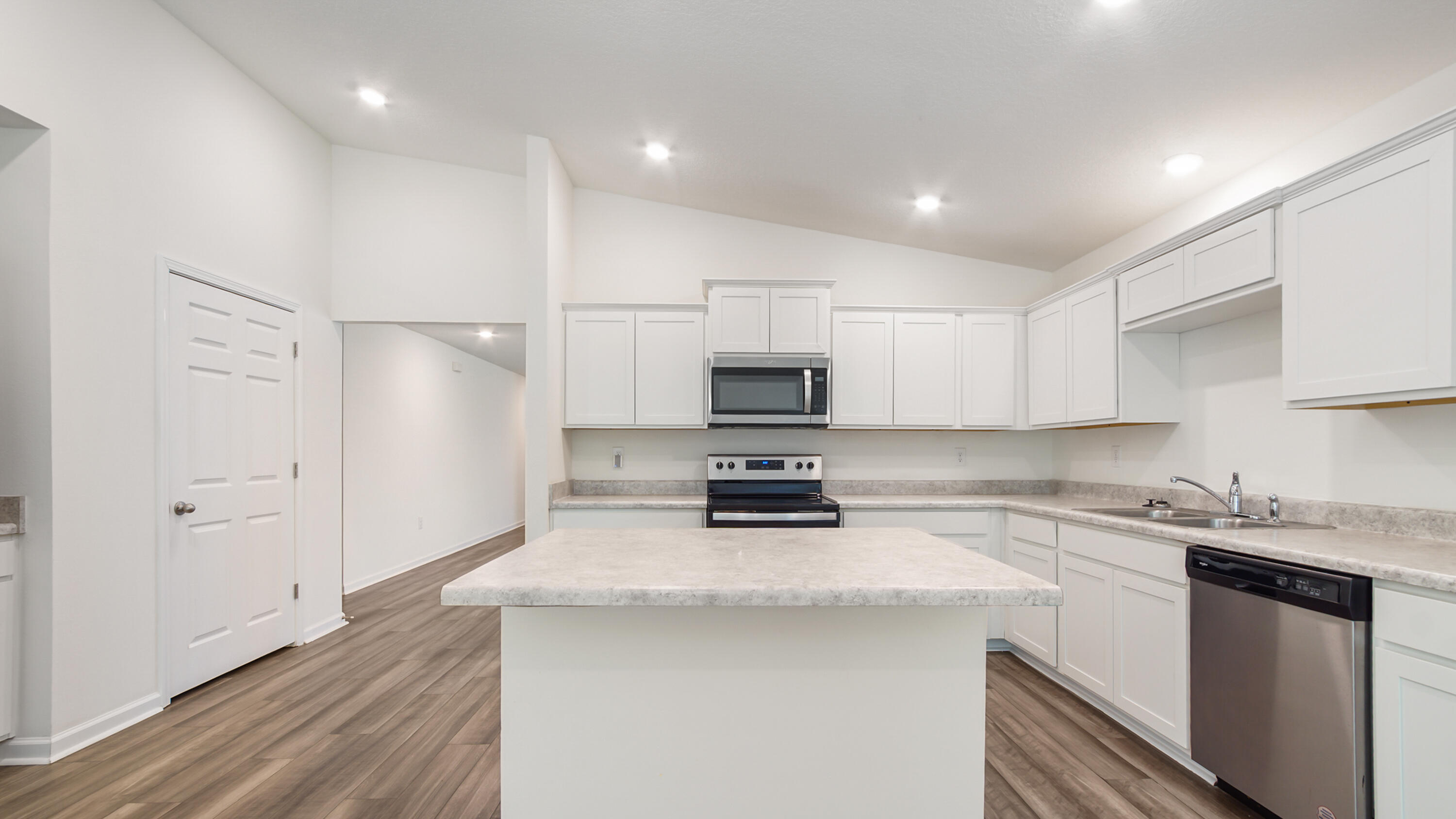 720 Riverwalk Circle Freeport, FL 32439 - Photo 29 of 50 a kitchen with stainless steel appliances a refrigerator sink and microwave
