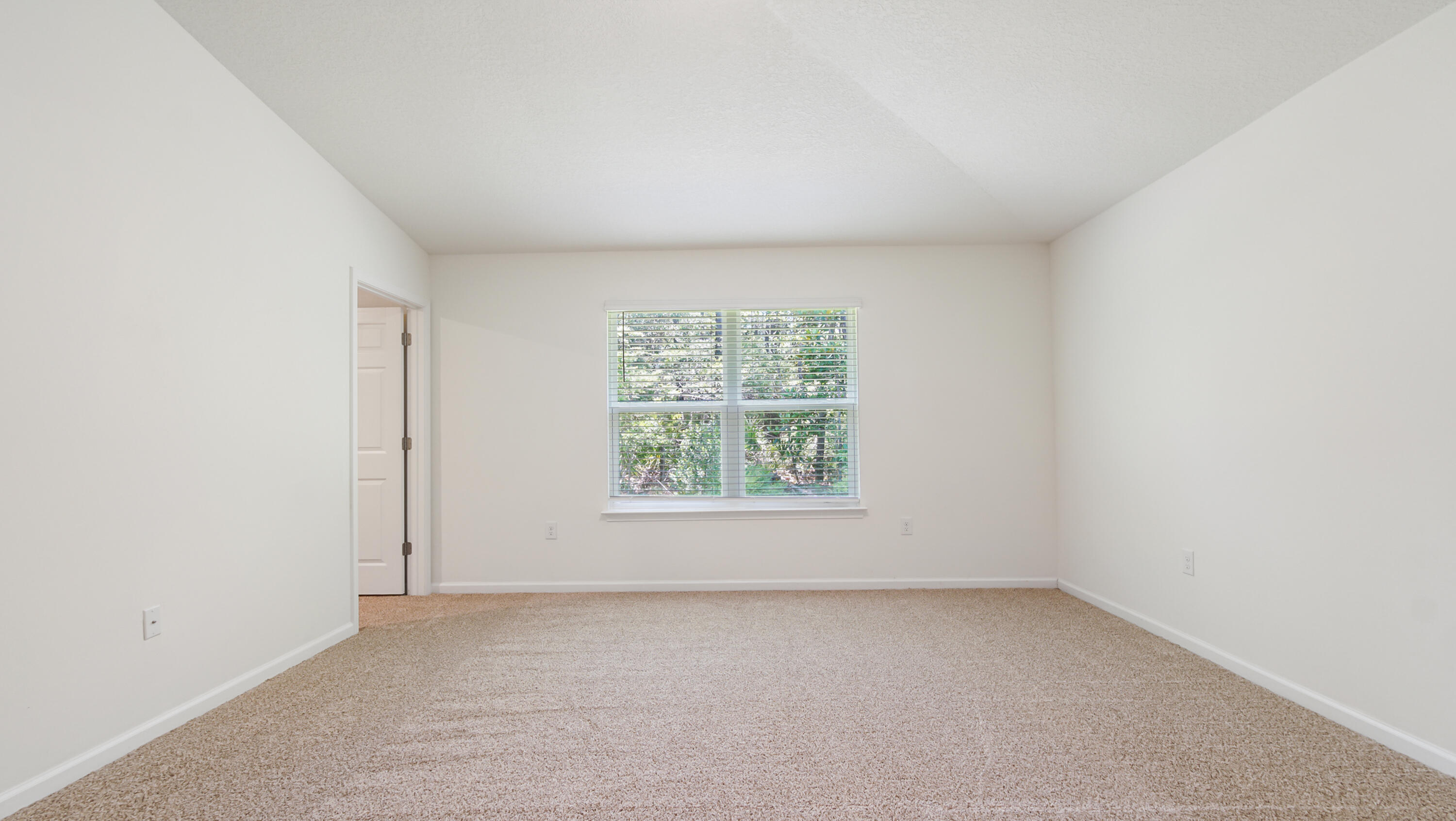 720 Riverwalk Circle Freeport, FL 32439 - Photo 33 of 50 an empty room with a window