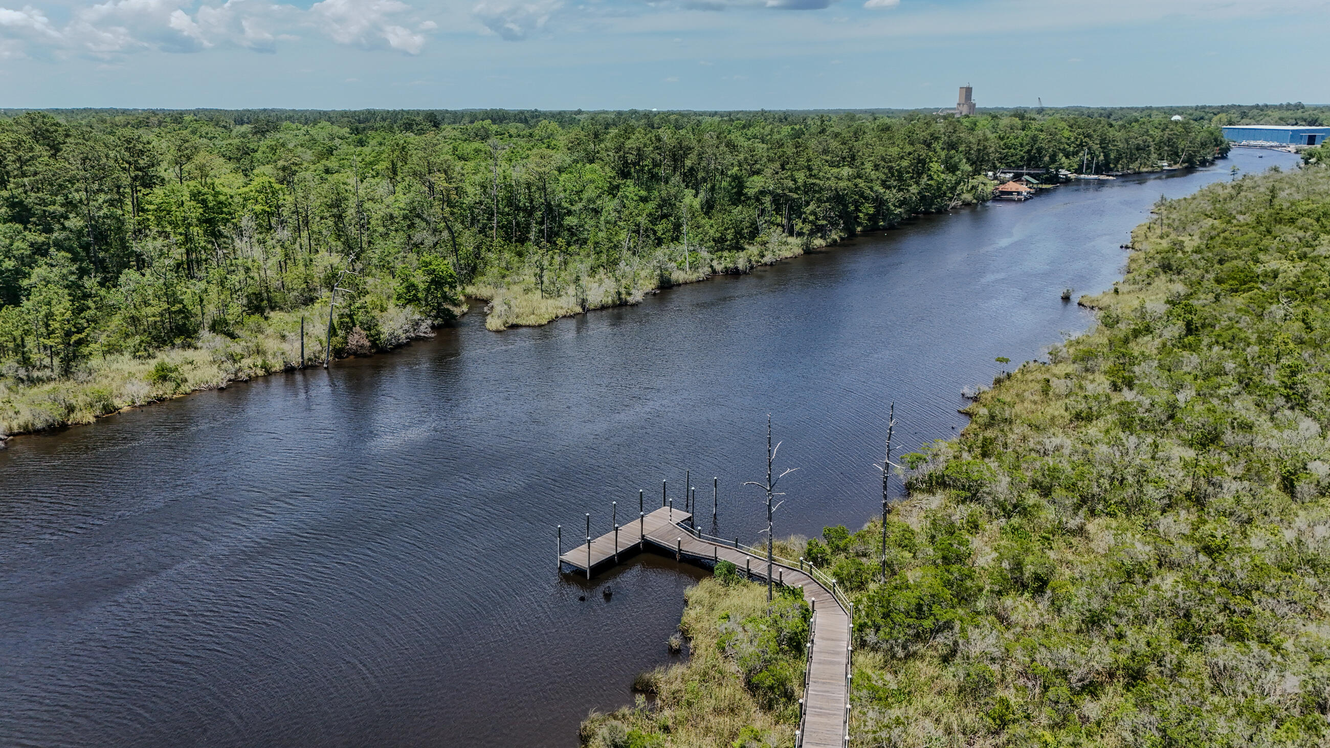 720 Riverwalk Circle Freeport, FL 32439 - Photo 46 of 50 an aerial view of a house with a yard and garden