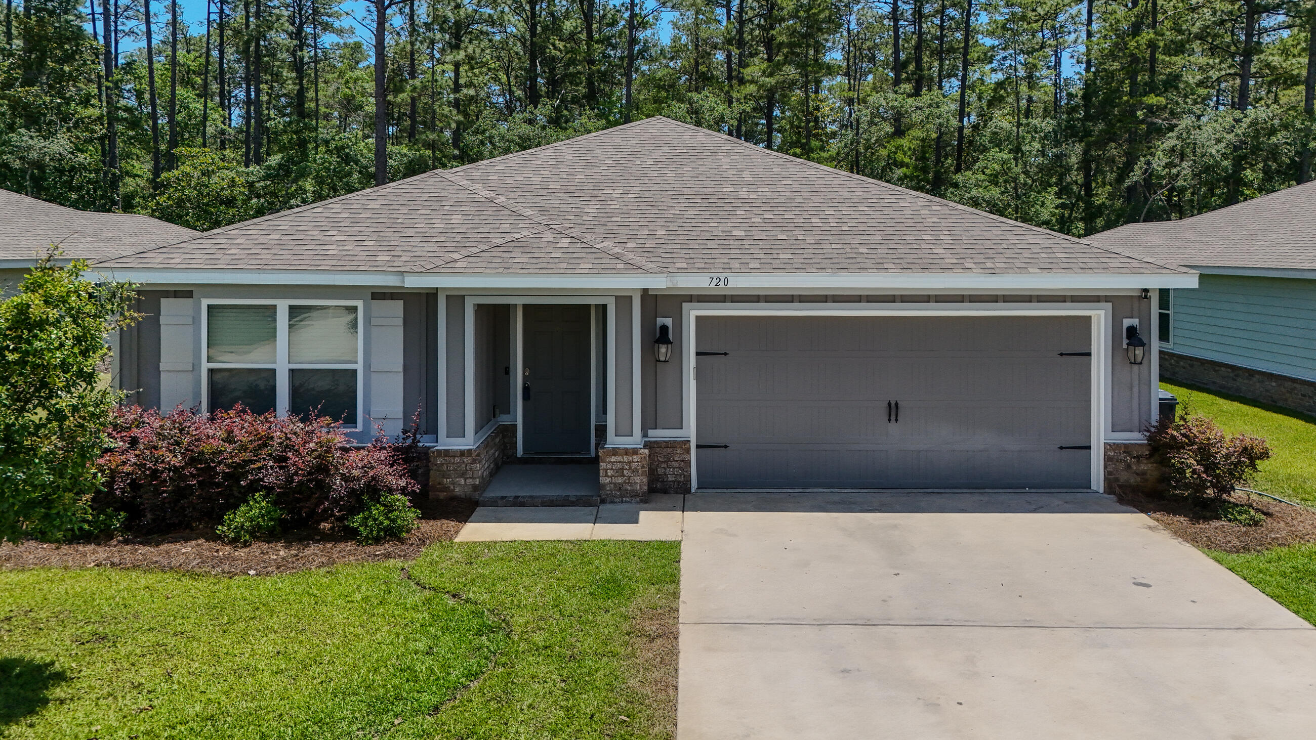 720 Riverwalk Circle Freeport, FL 32439 - Photo 48 of 50 a front view of house with yard and green space