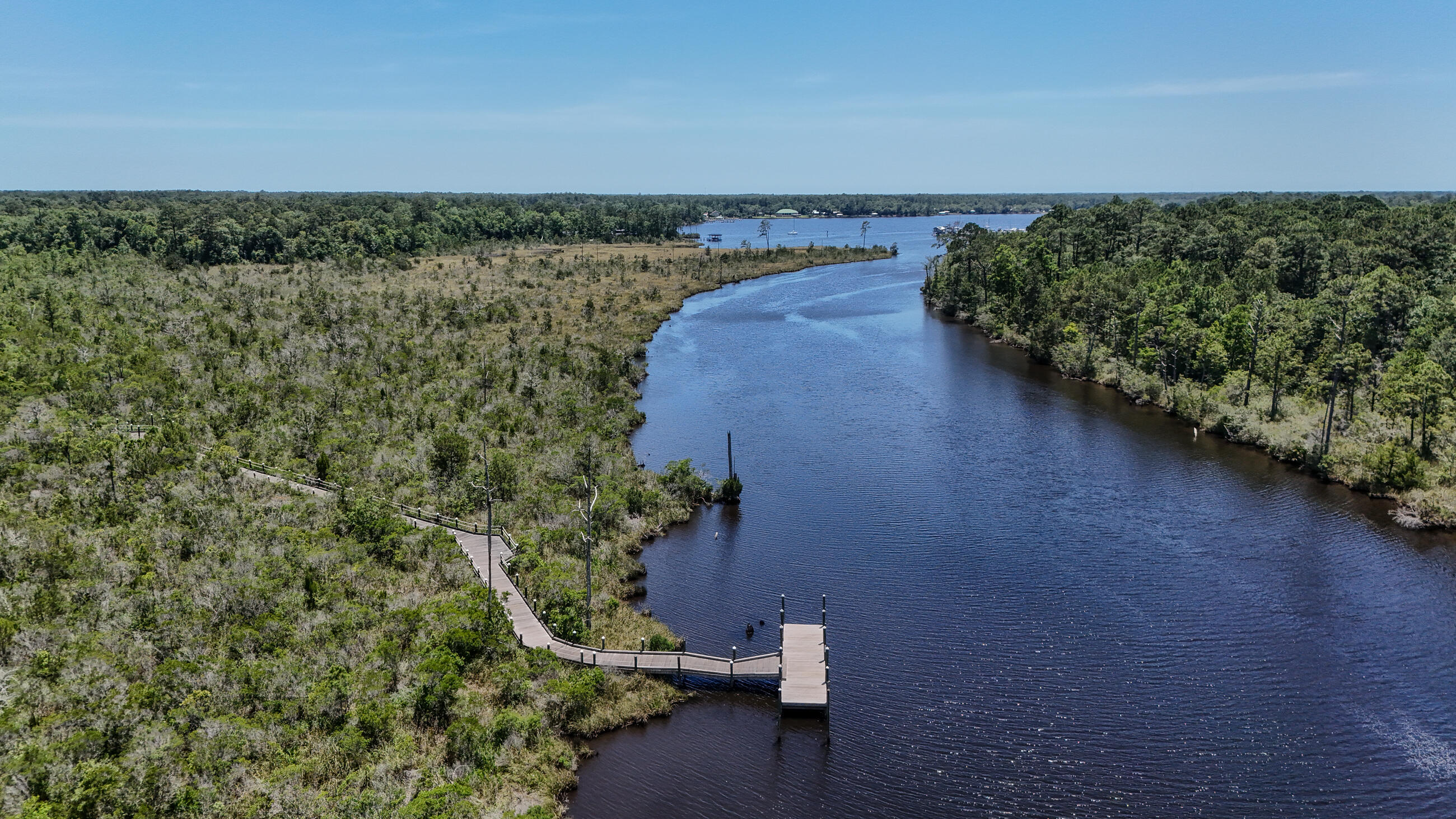 720 Riverwalk Circle Freeport, FL 32439 - Photo 6 of 50 a view of a lake with a mountain in the background